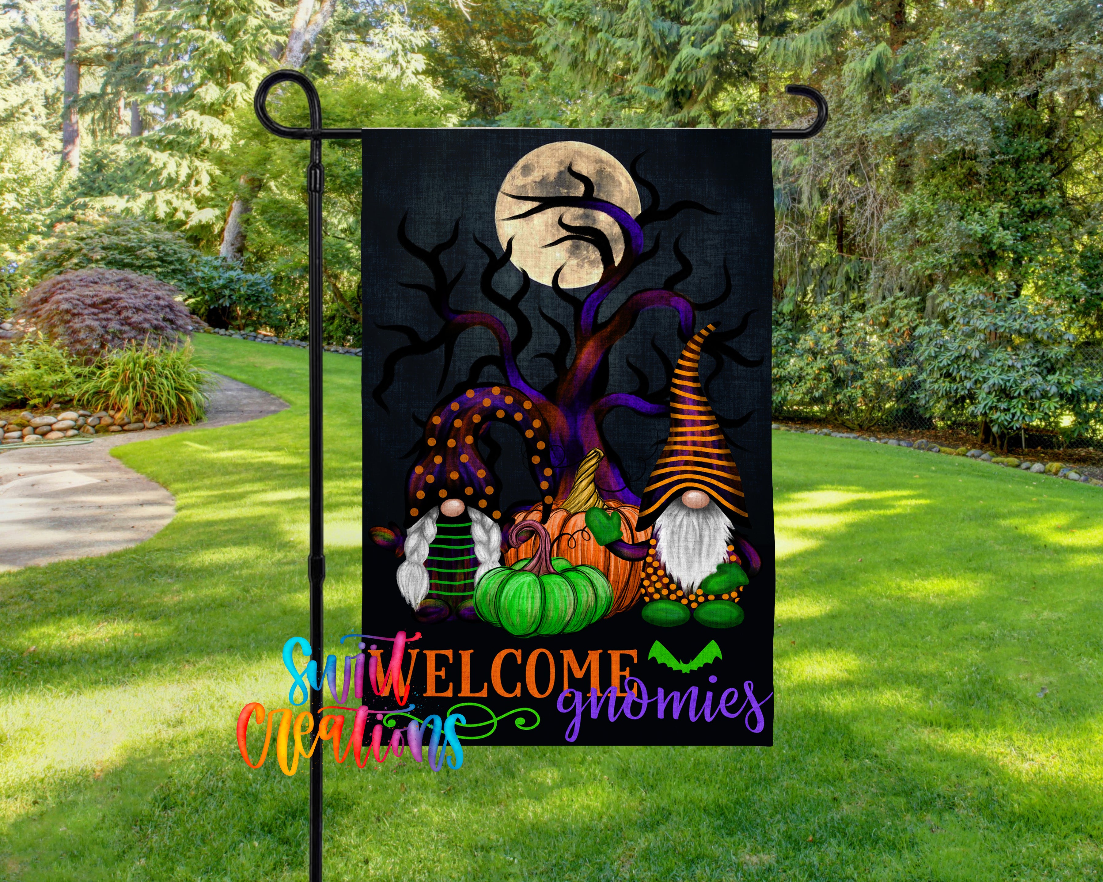 A garden flag featuring a Halloween-themed design with gnomes, pumpkins, and a full moon.