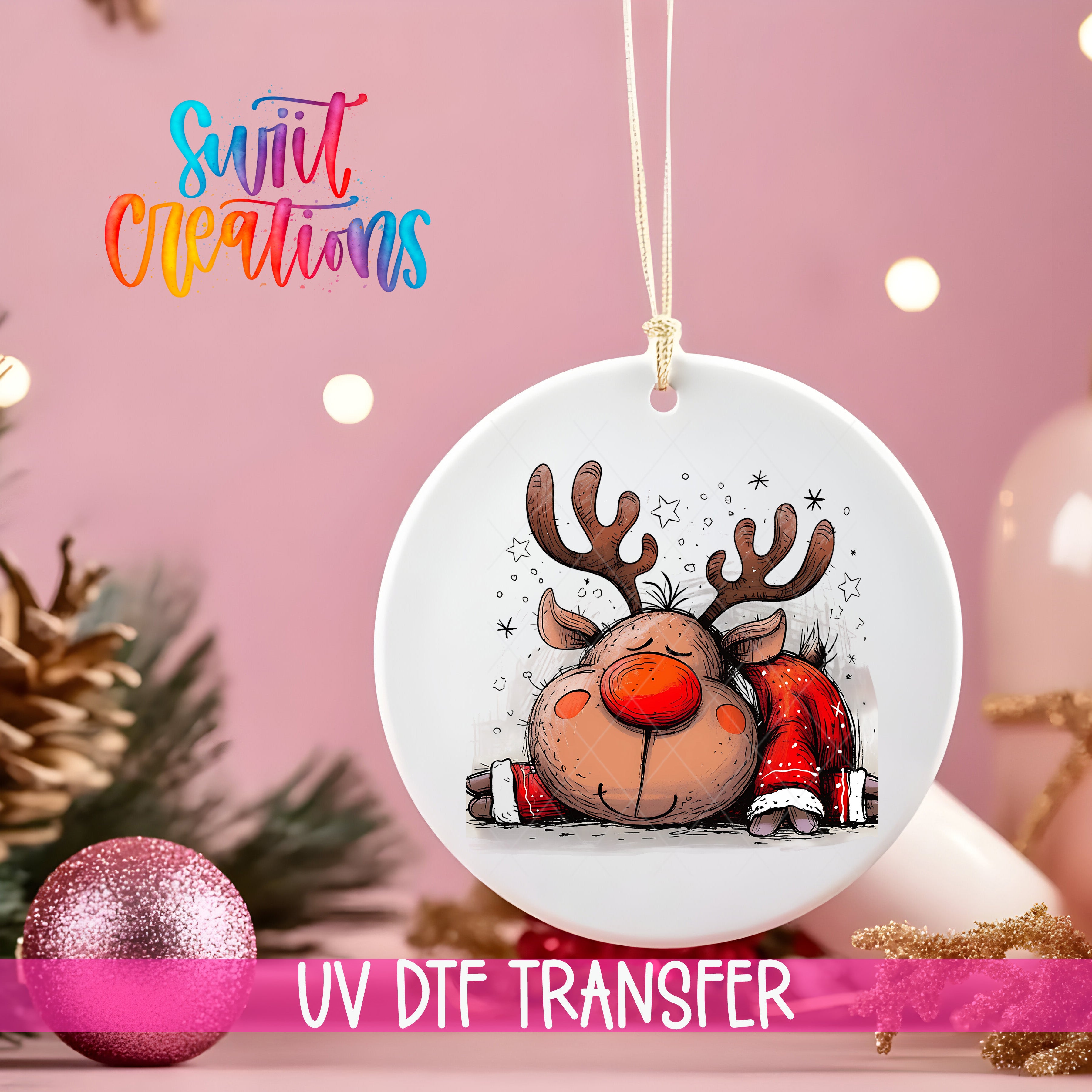 A white ceramic ornament with a cartoon reindeer design, hanging on a string against a pink background with Christmas decorations in the background.