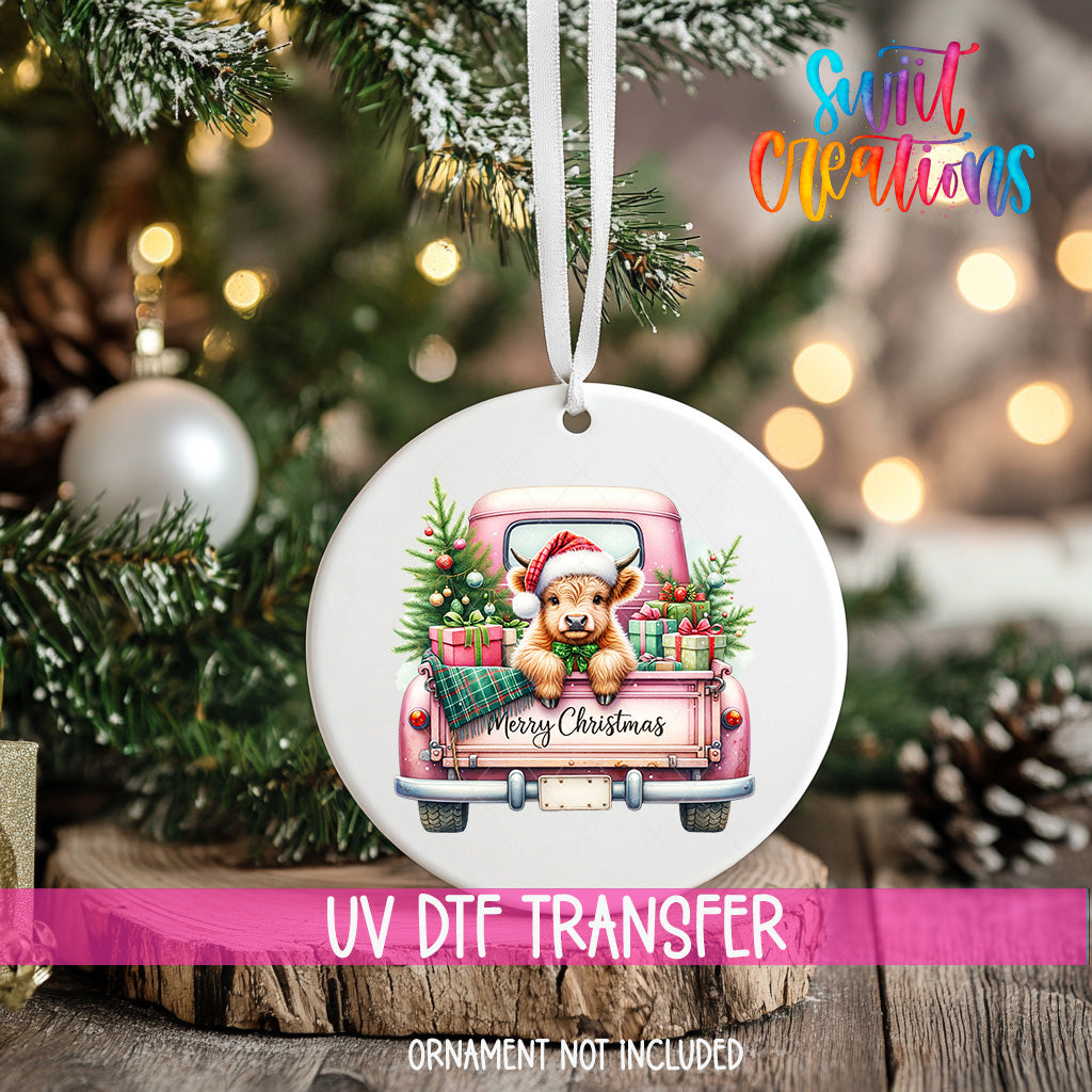 A Christmas ornament featuring a bear in a pink truck, surrounded by Christmas decorations and lights.