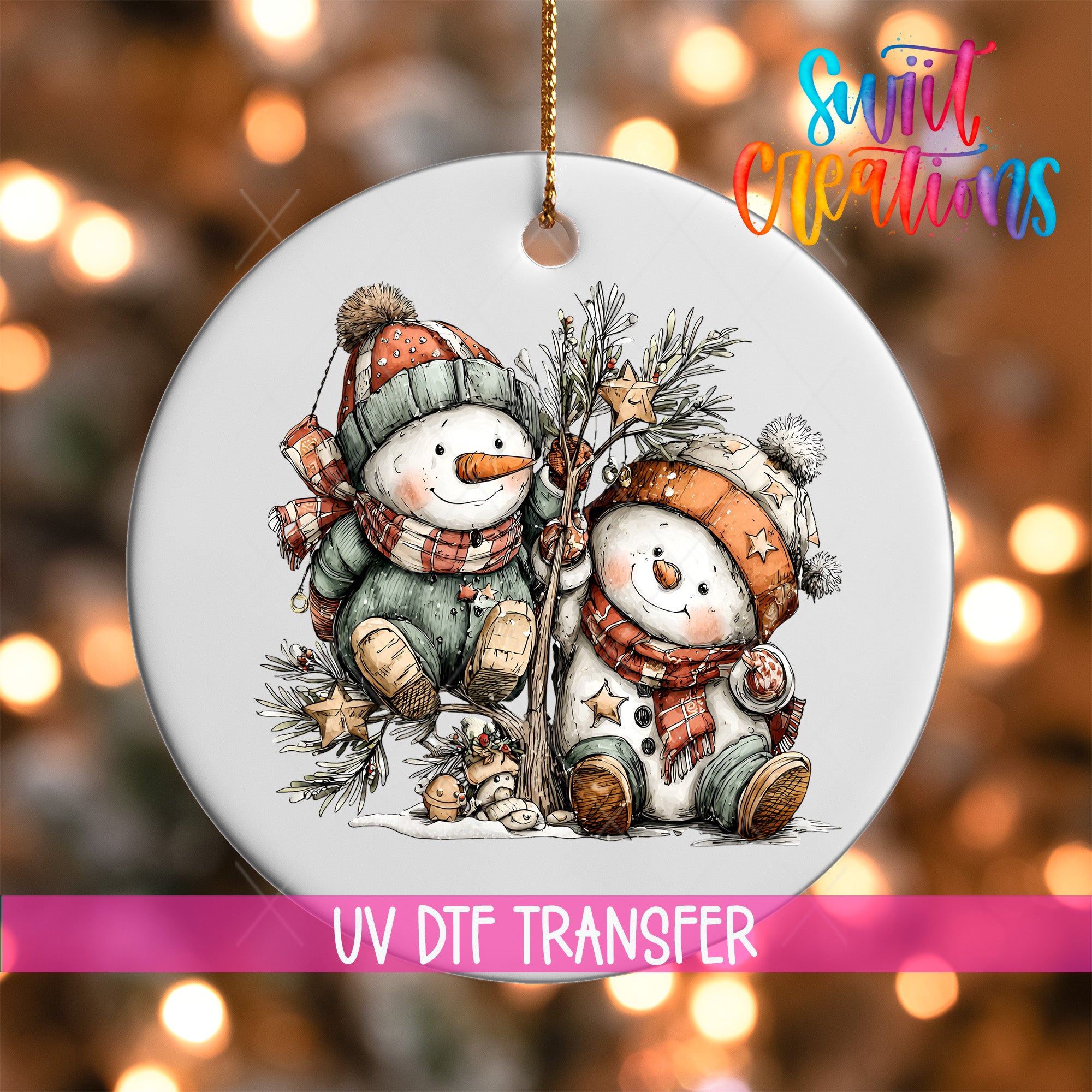 A white ornament featuring two snowmen, one standing and one sitting, against a blurred background with Christmas lights.