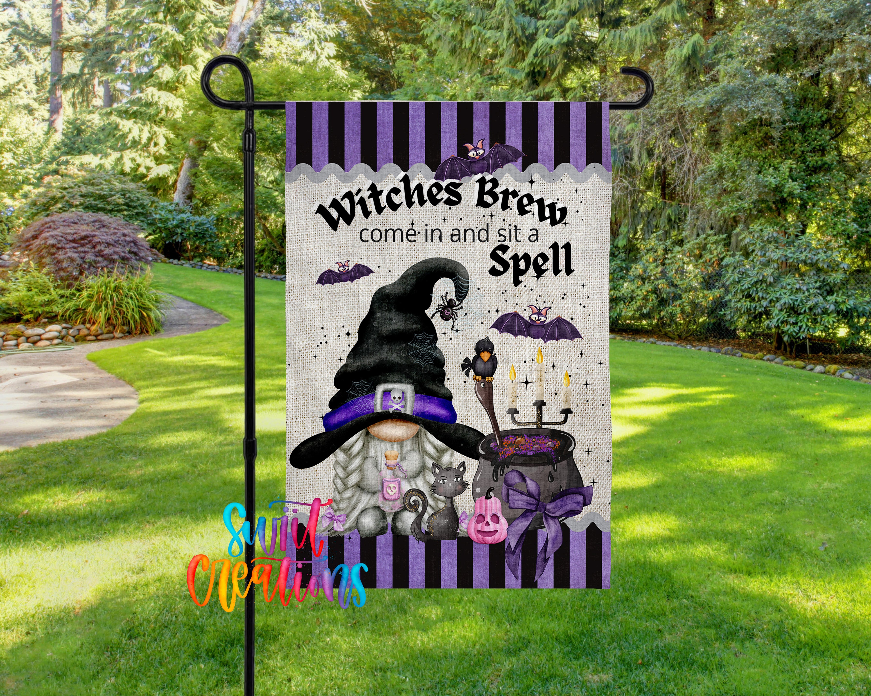 A garden flag featuring a whimsical illustration of a witch brewing a spell, surrounded by bats, pumpkins, and other Halloween-themed elements.