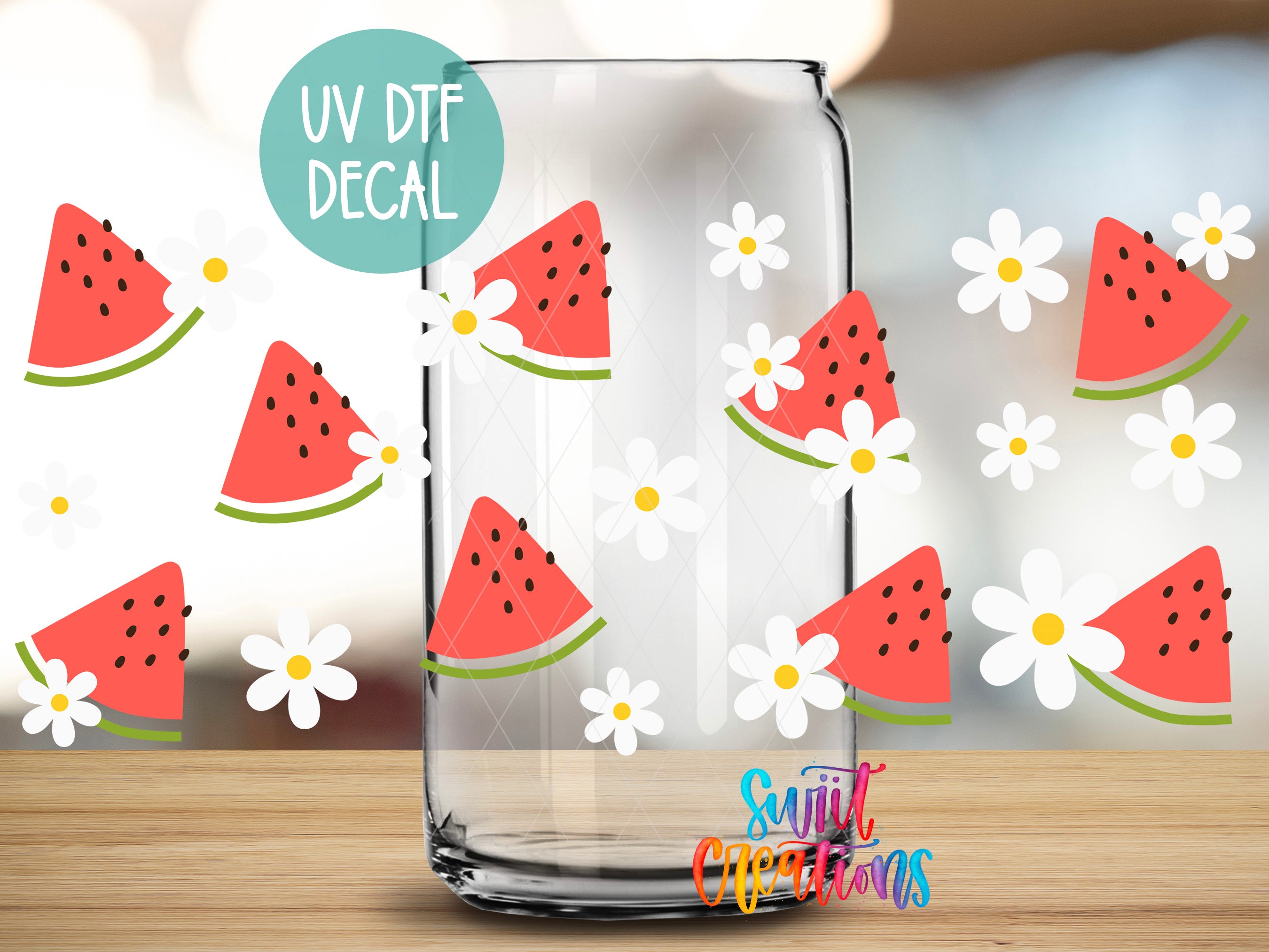 a clear glass jar with a UV decal of watermelon and white flowers on it, placed on a wooden surface.