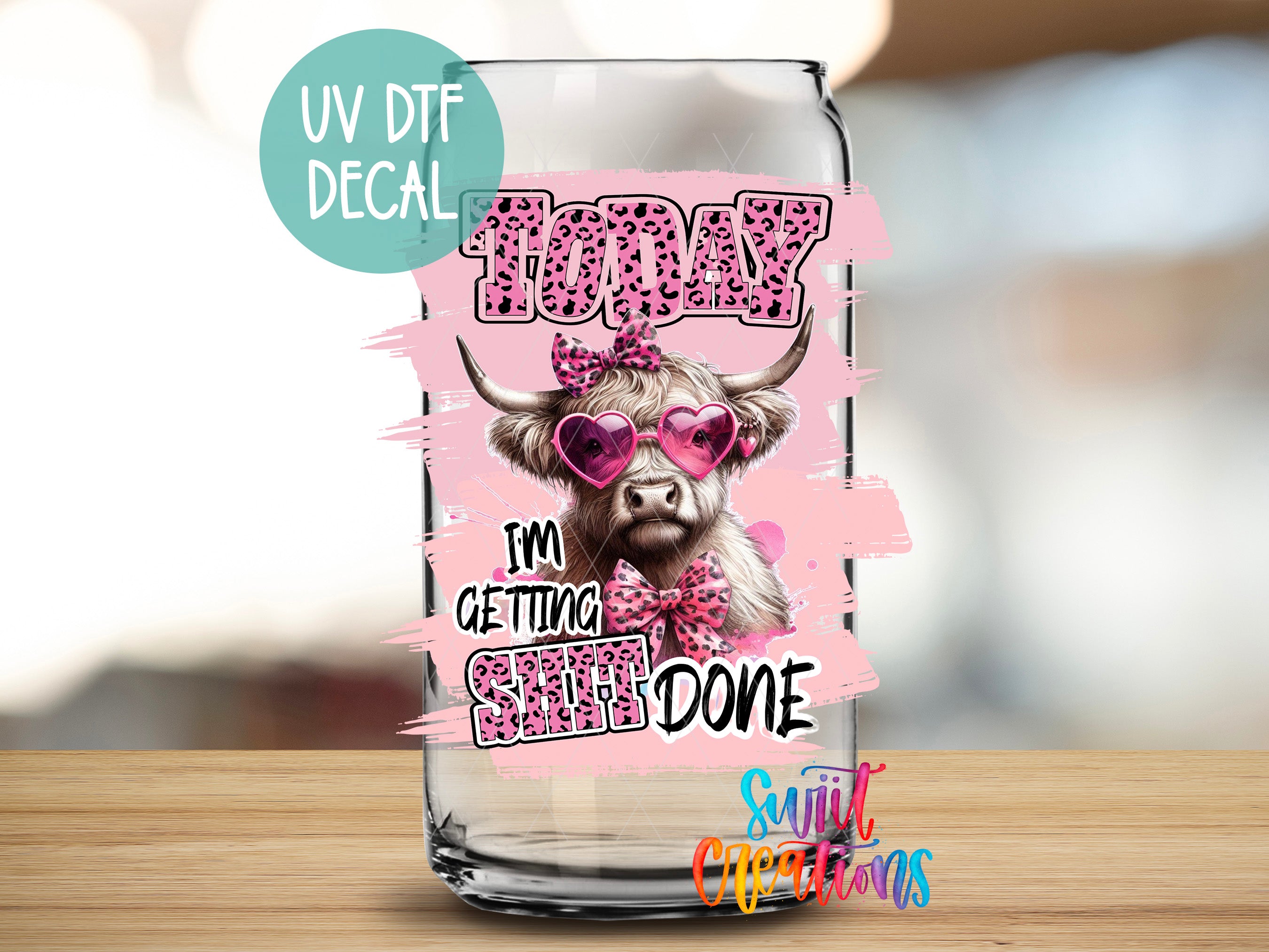 a glass with a cow wearing sunglasses on it