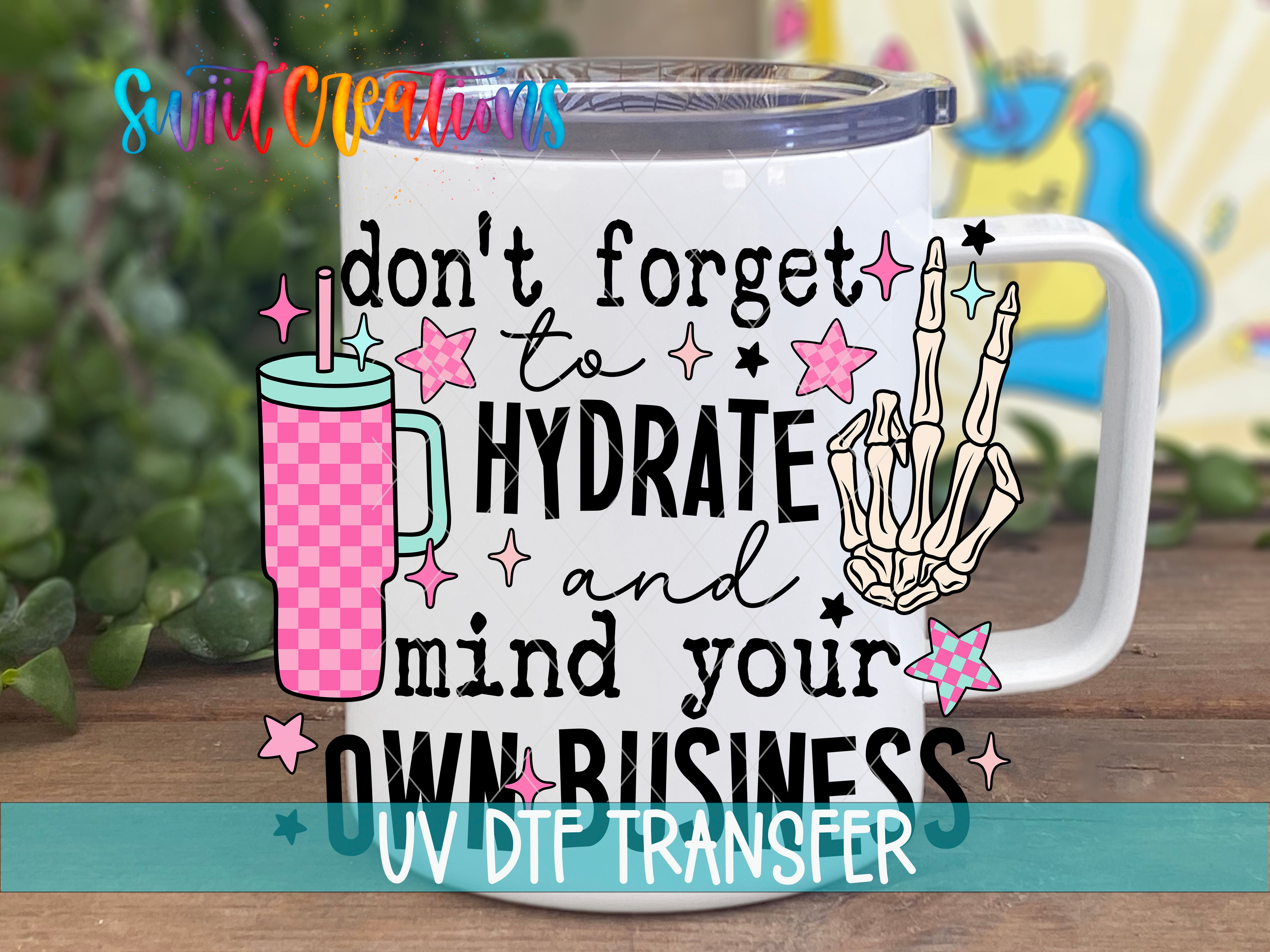 Swiit Creations UV DTF Hydrate and Mind Your Business transfer displayed on a white coffee mug