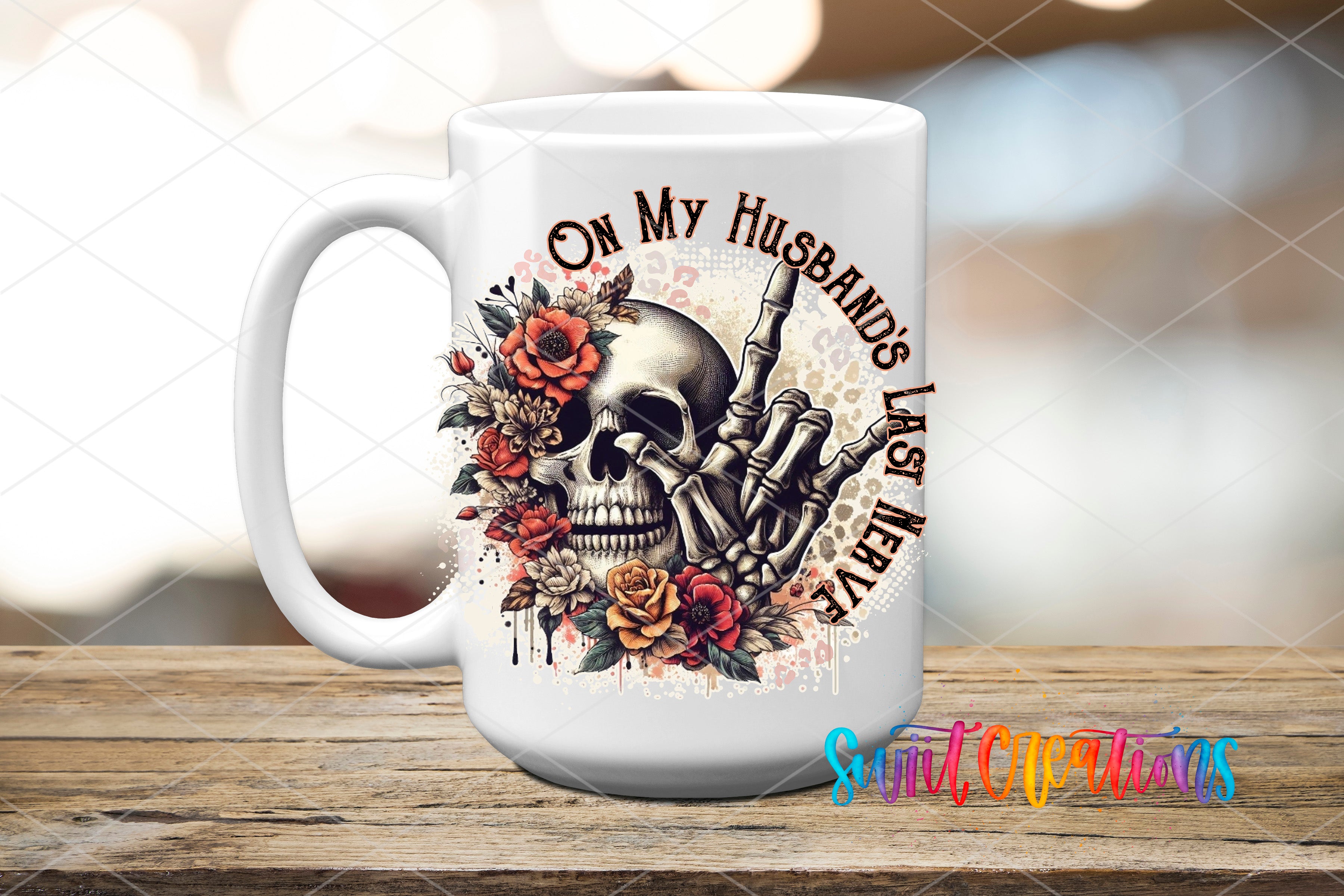 A white ceramic mug with a skull design and floral elements, along with the text "On My Husband's Last Meal" printed on it.