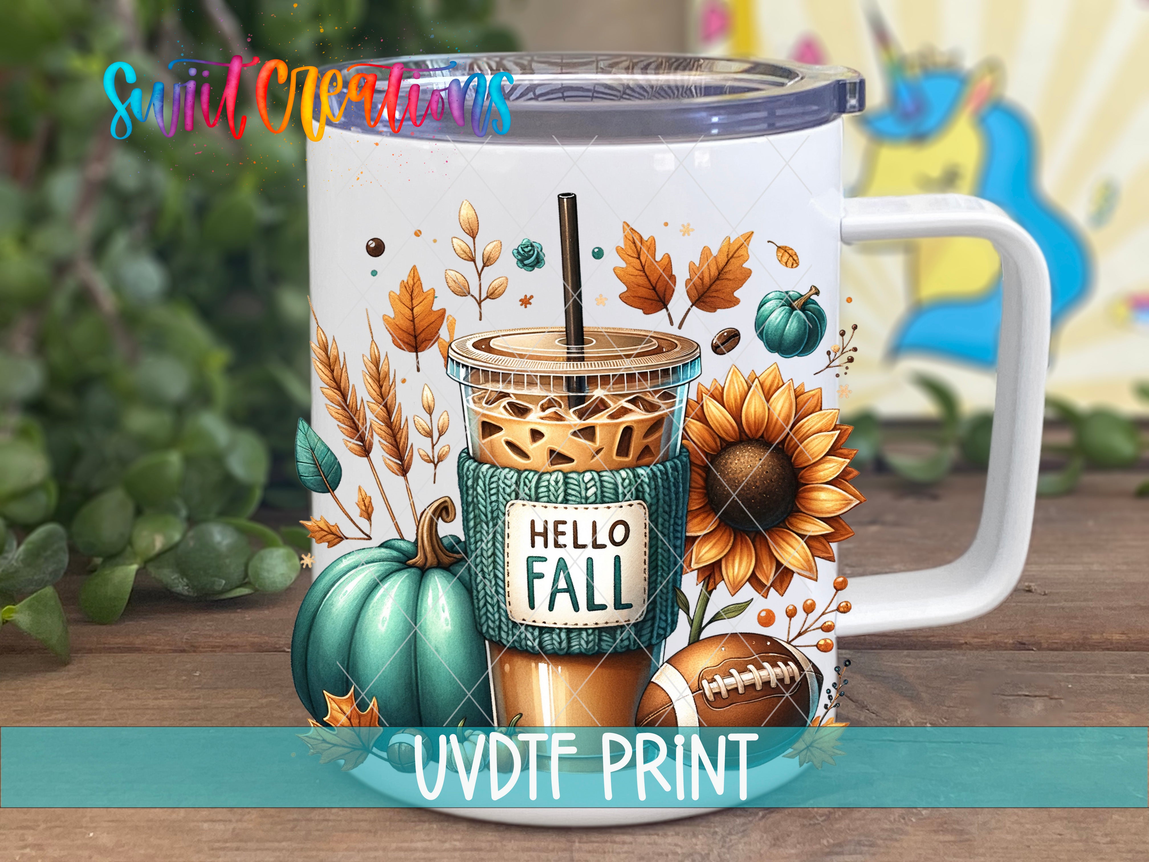 A white mug with a colorful autumn-themed design, including a coffee drink, pumpkin, sunflower, and football.