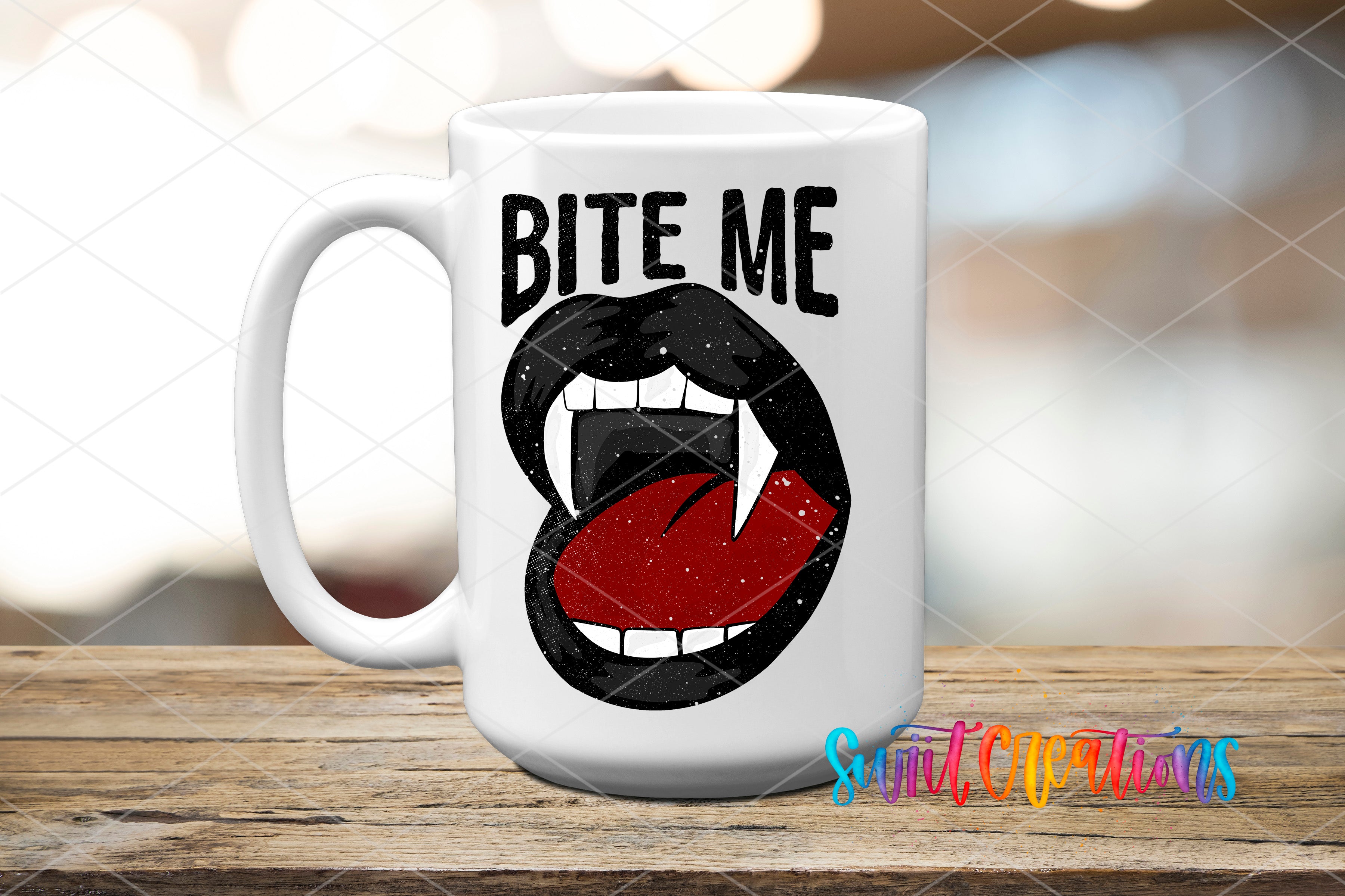 A white mug with a graphic design featuring a pair of open-mouthed fangs and the text "BITE ME" printed on it.