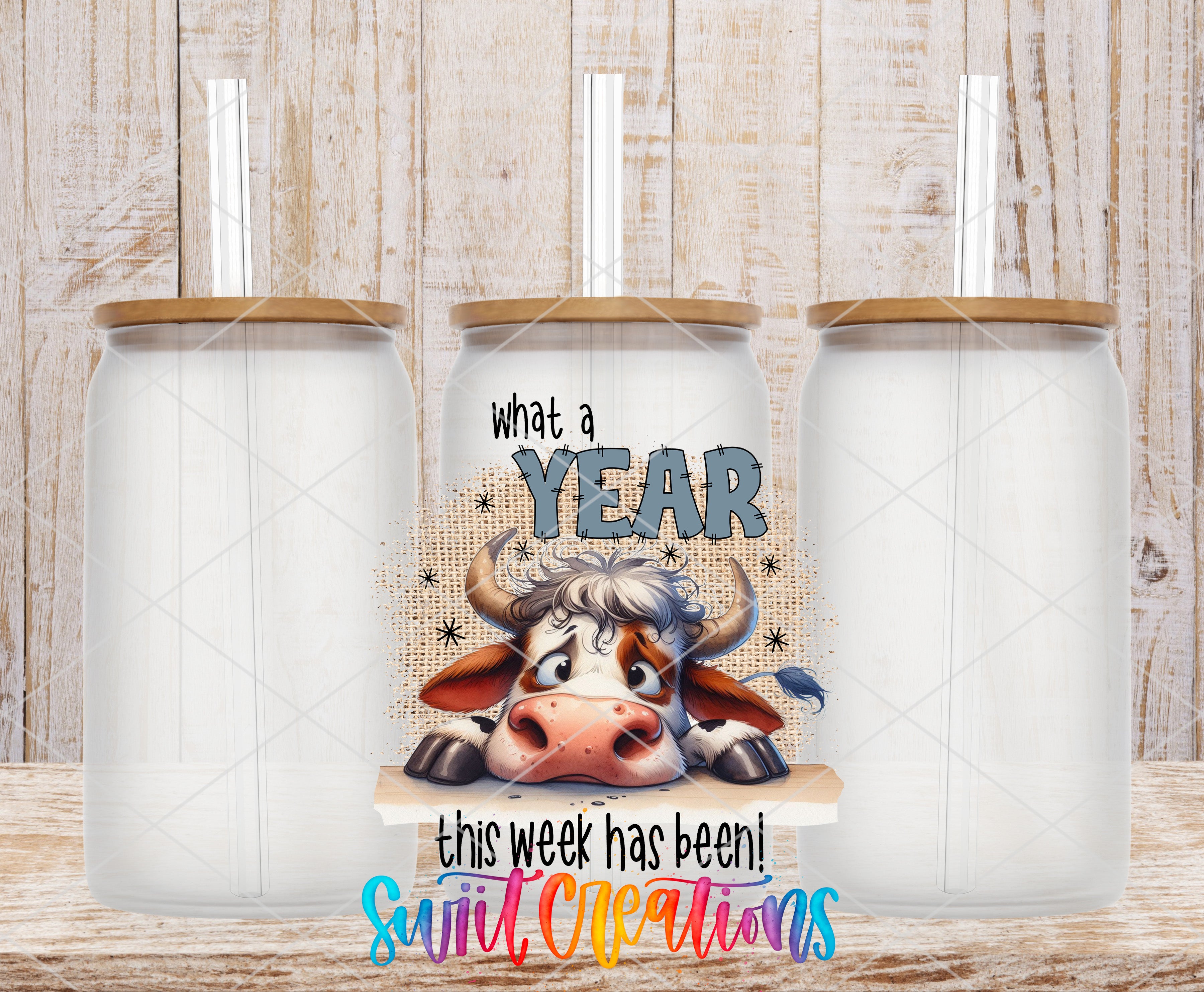 Swiit Creations UV DTF What a Year This Week Has Been transfer shown on a clear glass can set