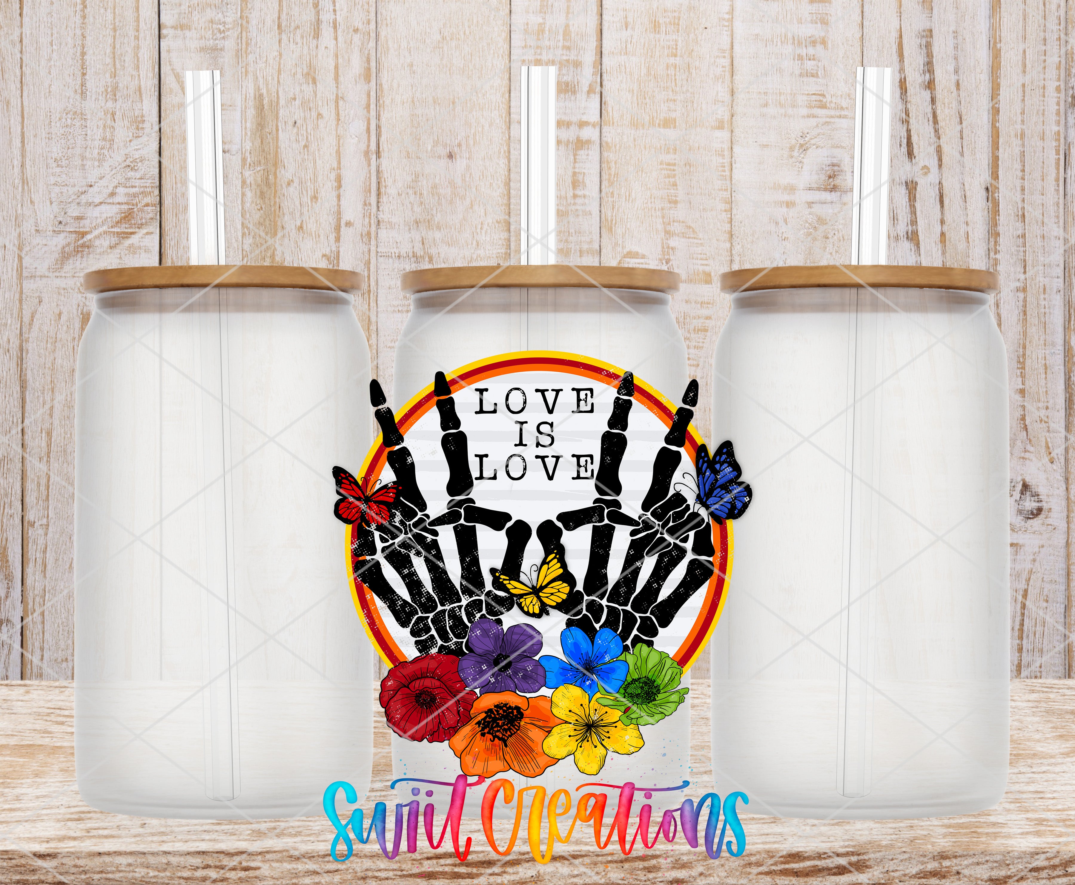 Three clear glass cans with the Love Is Love UV DTF transfer by Swiit Creations