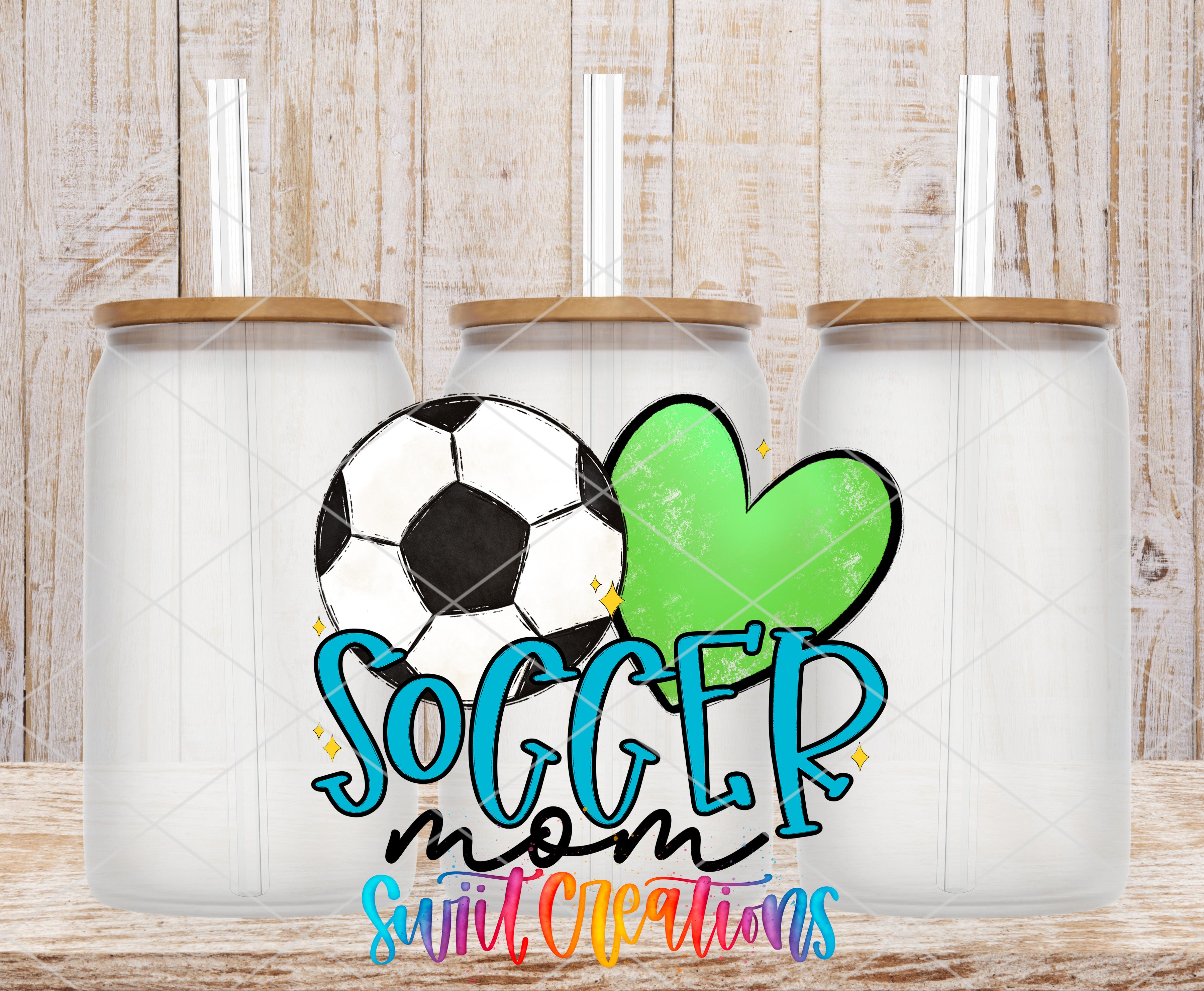 three glass jars with lids, each containing a straw, arranged in a row. The jars are set against a wooden background. The text "SOCCER mom sweet creations" is displayed prominently in the center of the image.