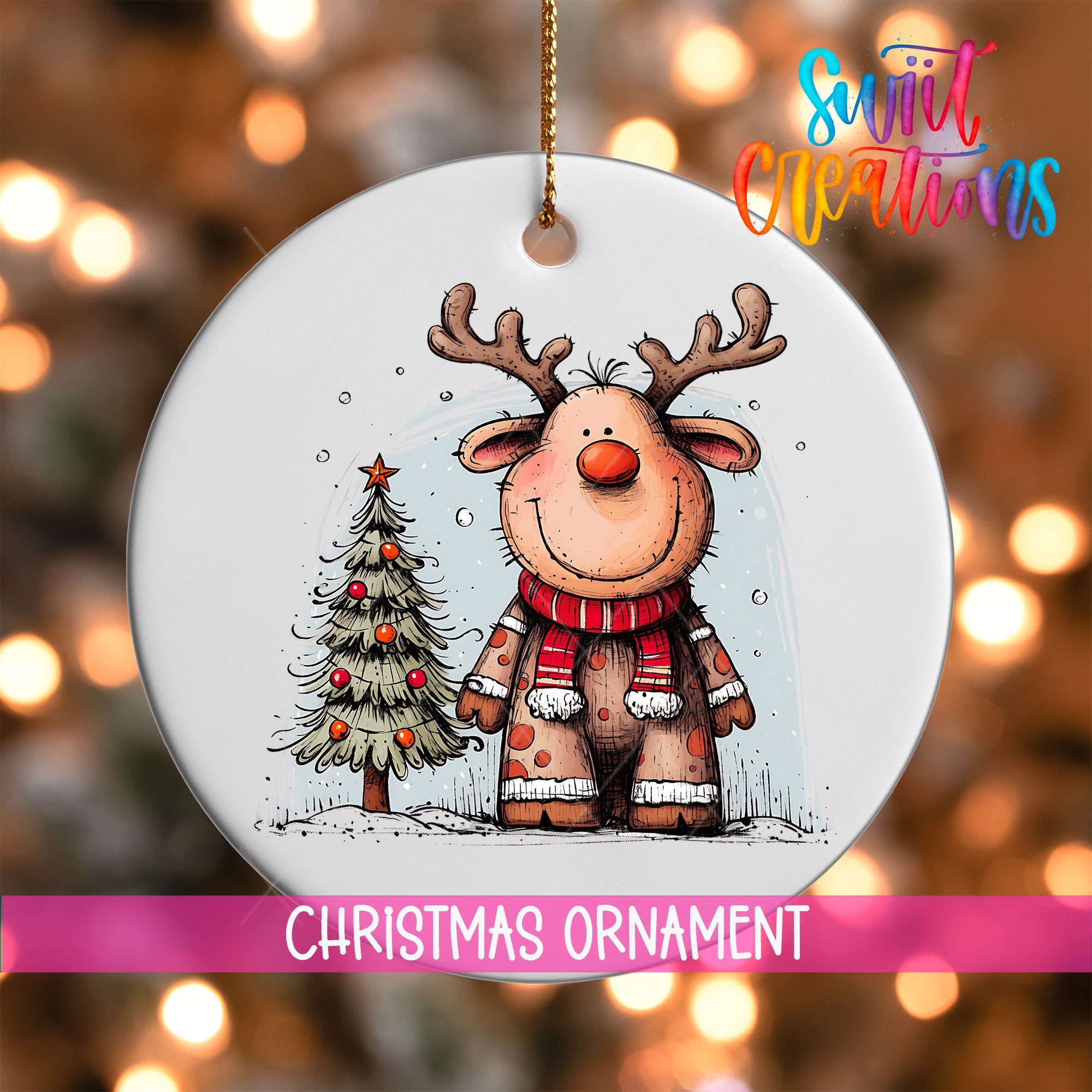 A Christmas ornament featuring a cartoon reindeer standing next to a Christmas tree.