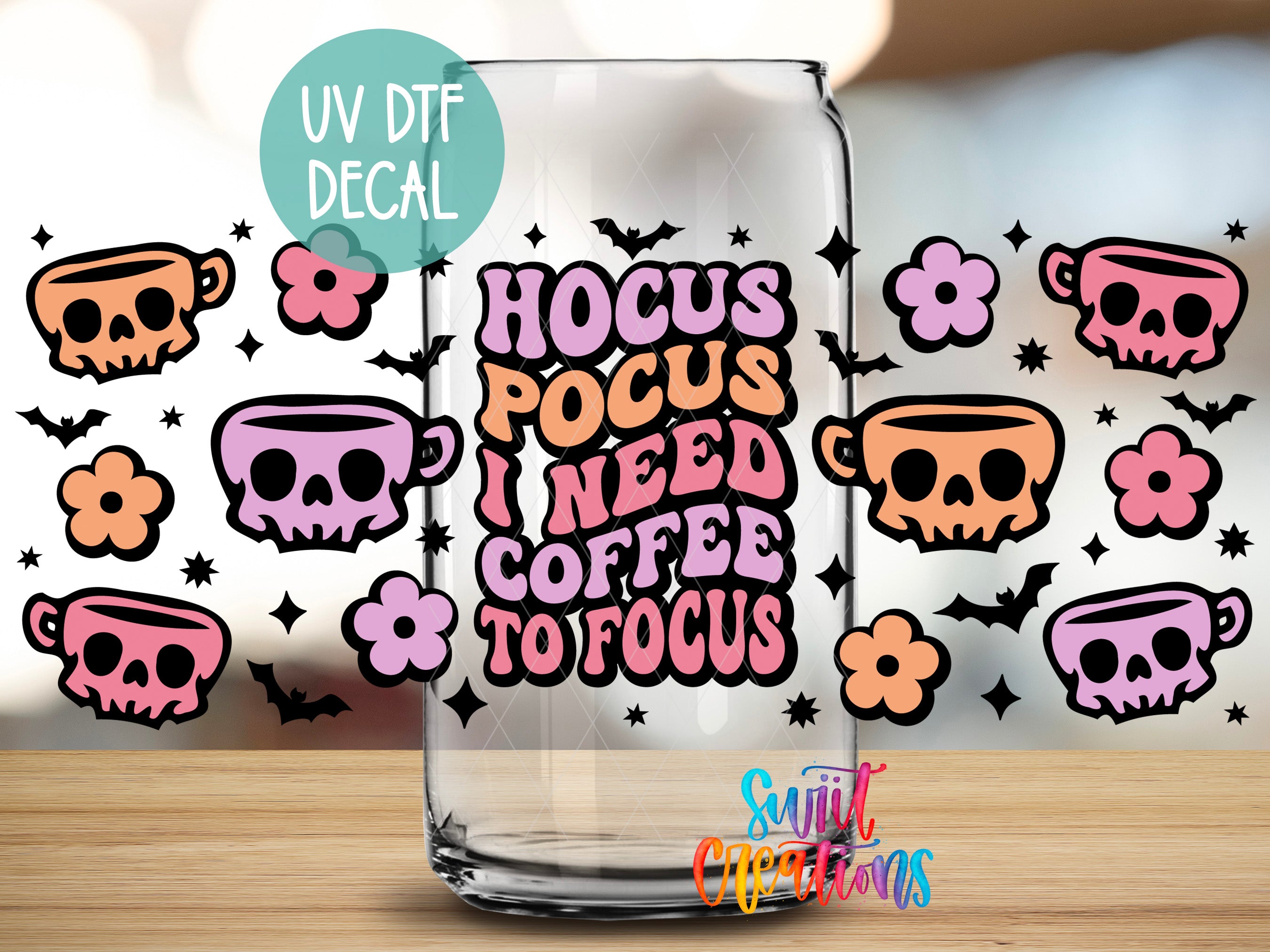 a glass with a sticker on it, surrounded by various skull and floral designs.