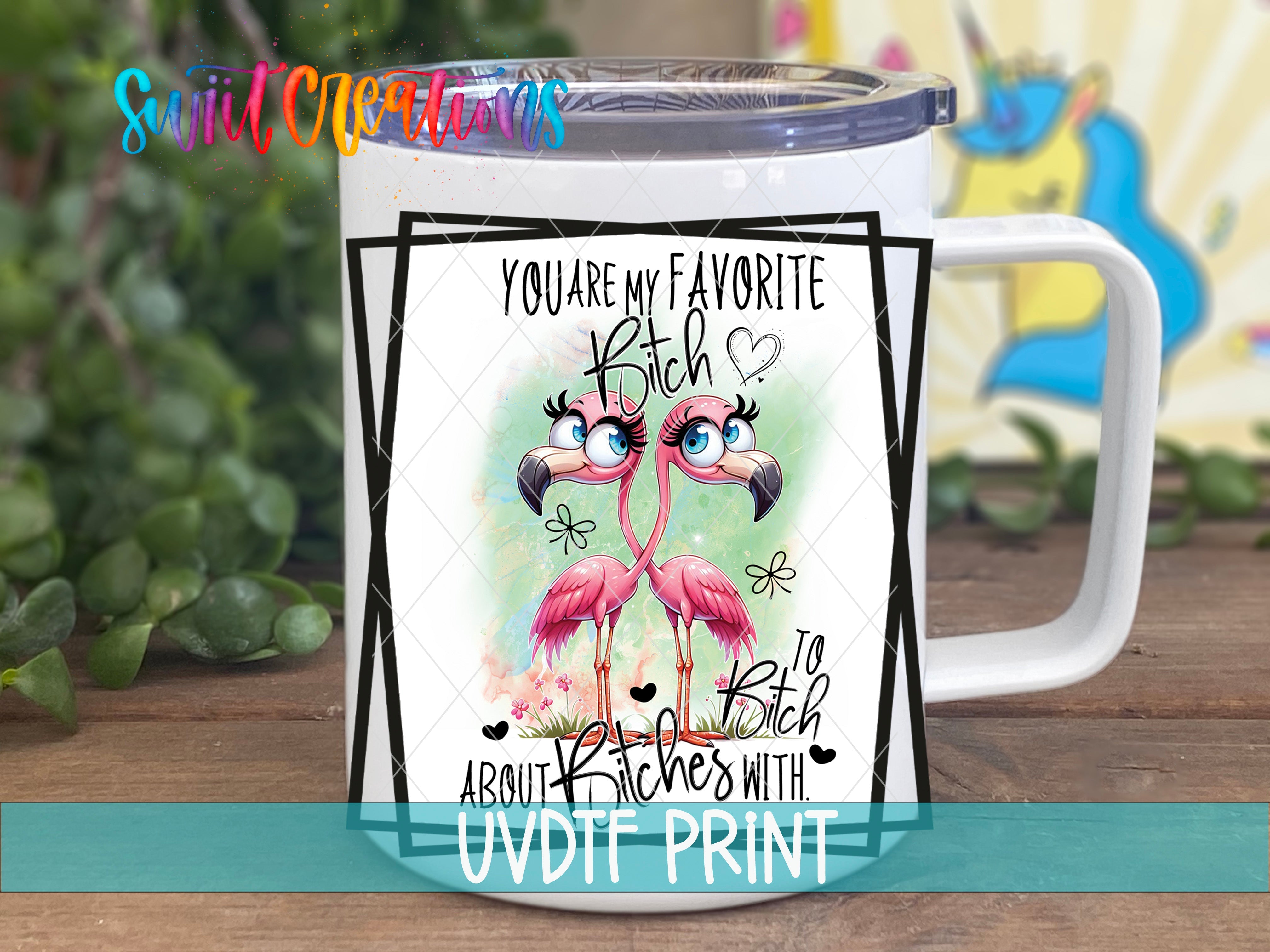 a white coffee mug with a pink flamingo on it