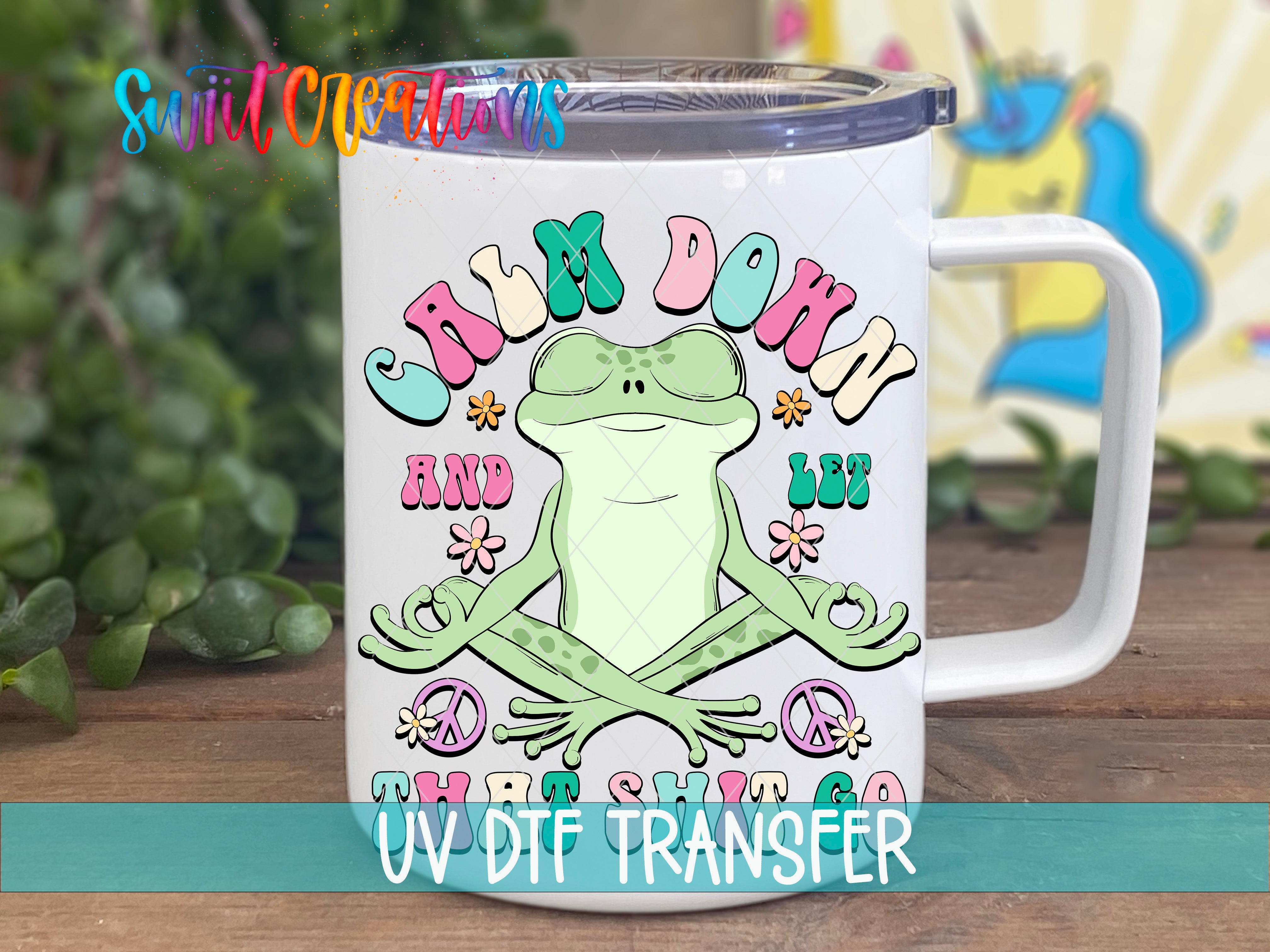 Swiit Creations UV DTF Calm Down And Let That Shit Go transfer displayed on a white coffee mug