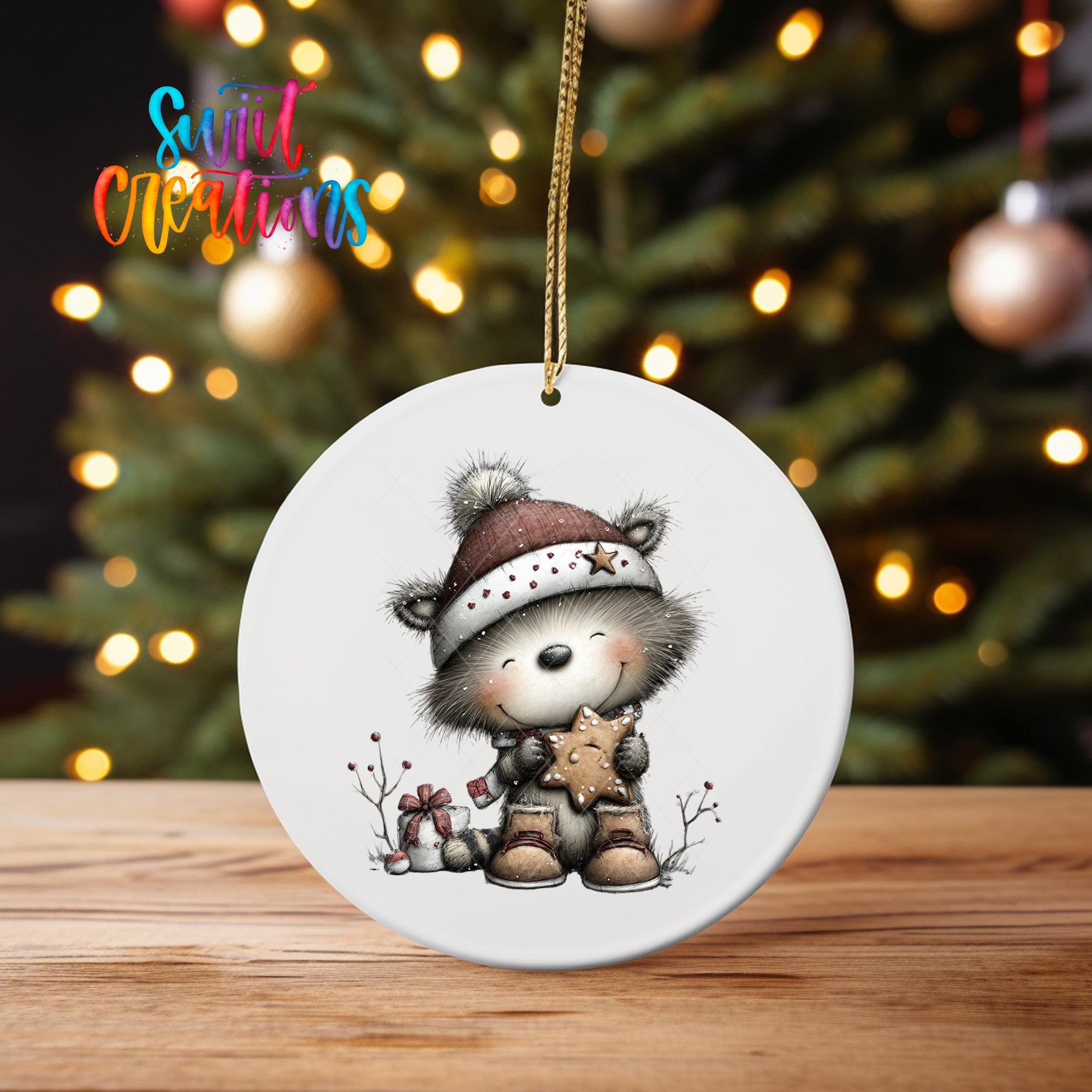 A white ceramic ornament featuring a cartoon image of a smiling bear wearing a hat and holding a star, set against a blurred background of Christmas lights.