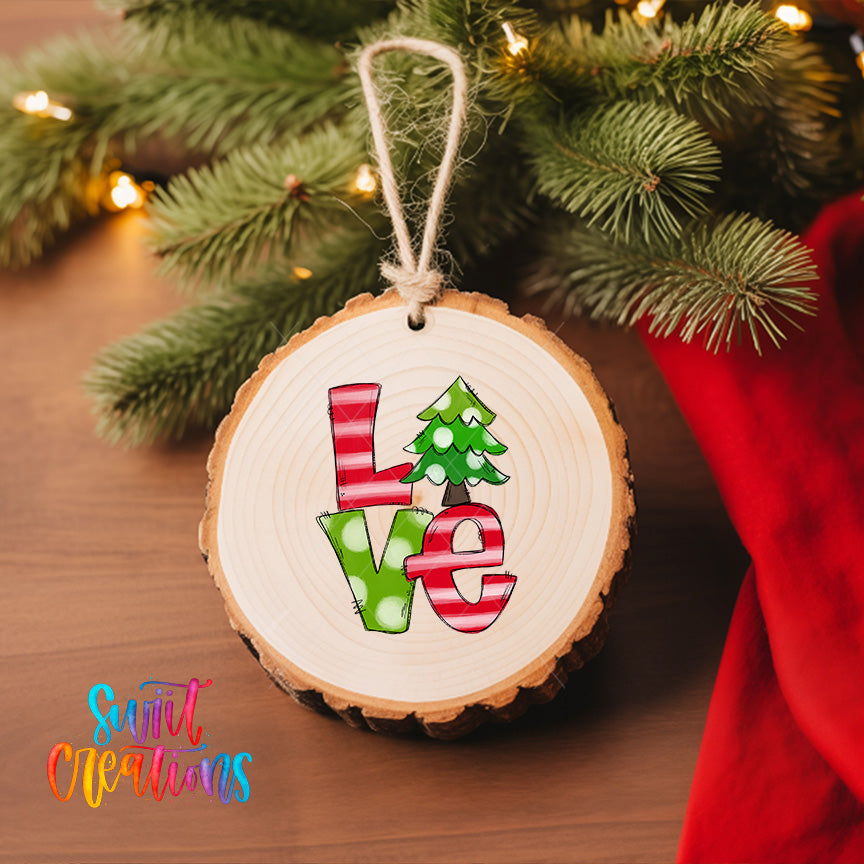A wooden ornament with the word "Love" written on it, hanging on a Christmas tree.