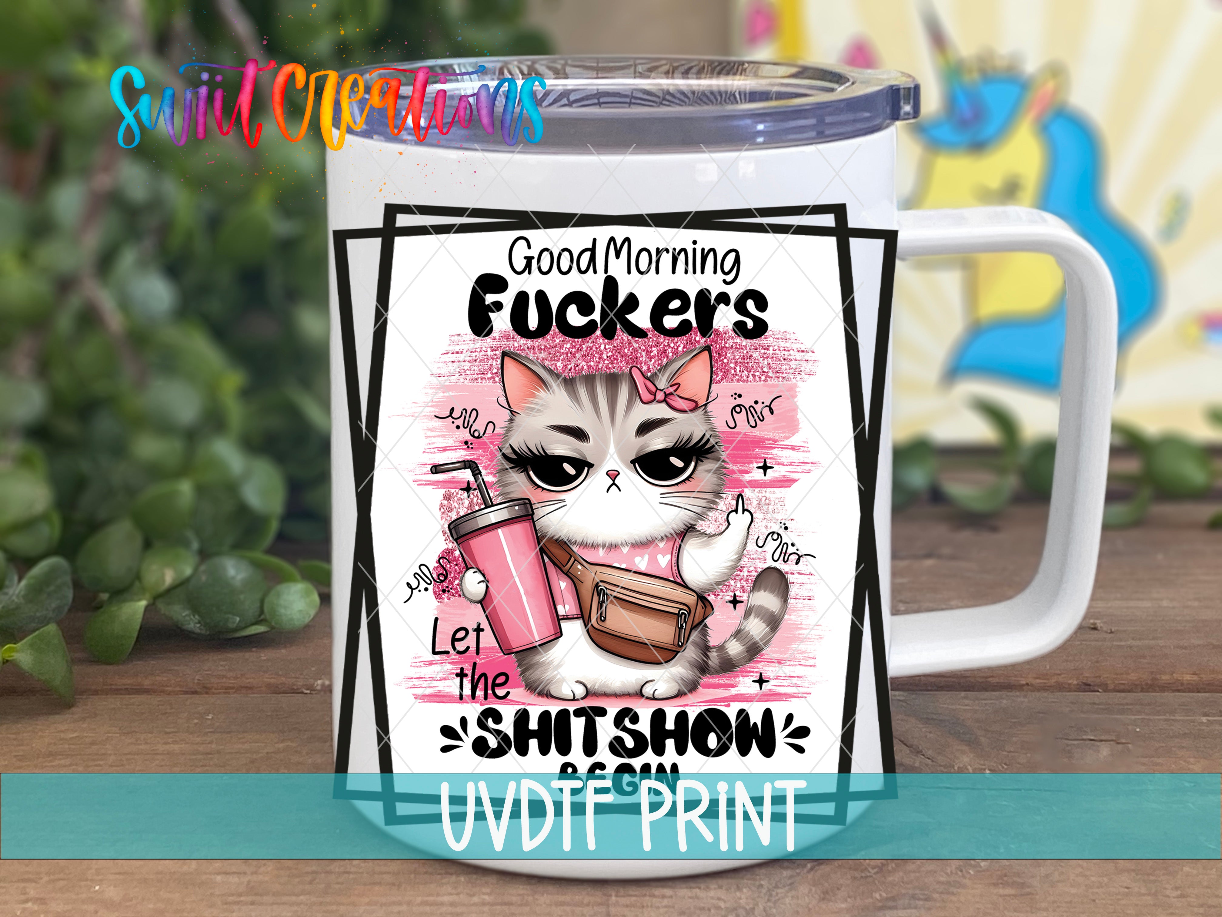 a white coffee mug with a picture of a cat on it