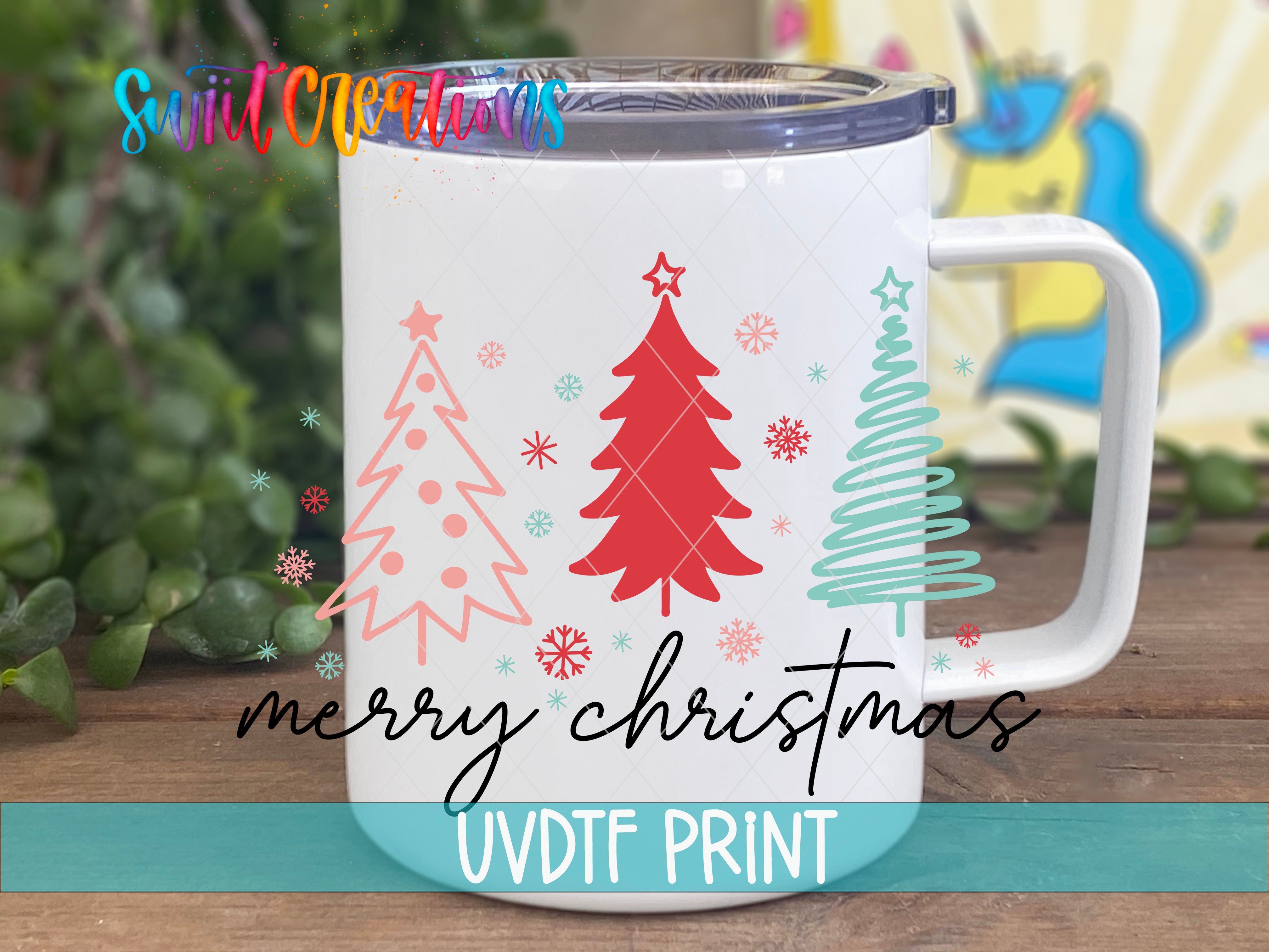 a white coffee mug with a christmas tree on it