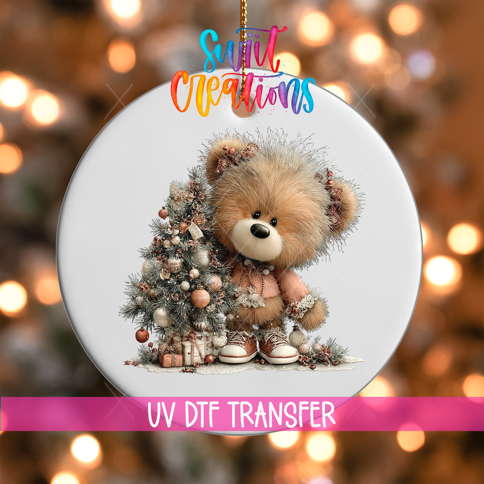 A round ornament featuring a teddy bear sitting next to a Christmas tree, with the text "Sweet Creations" and "UV Dtf Transfer" printed on it.