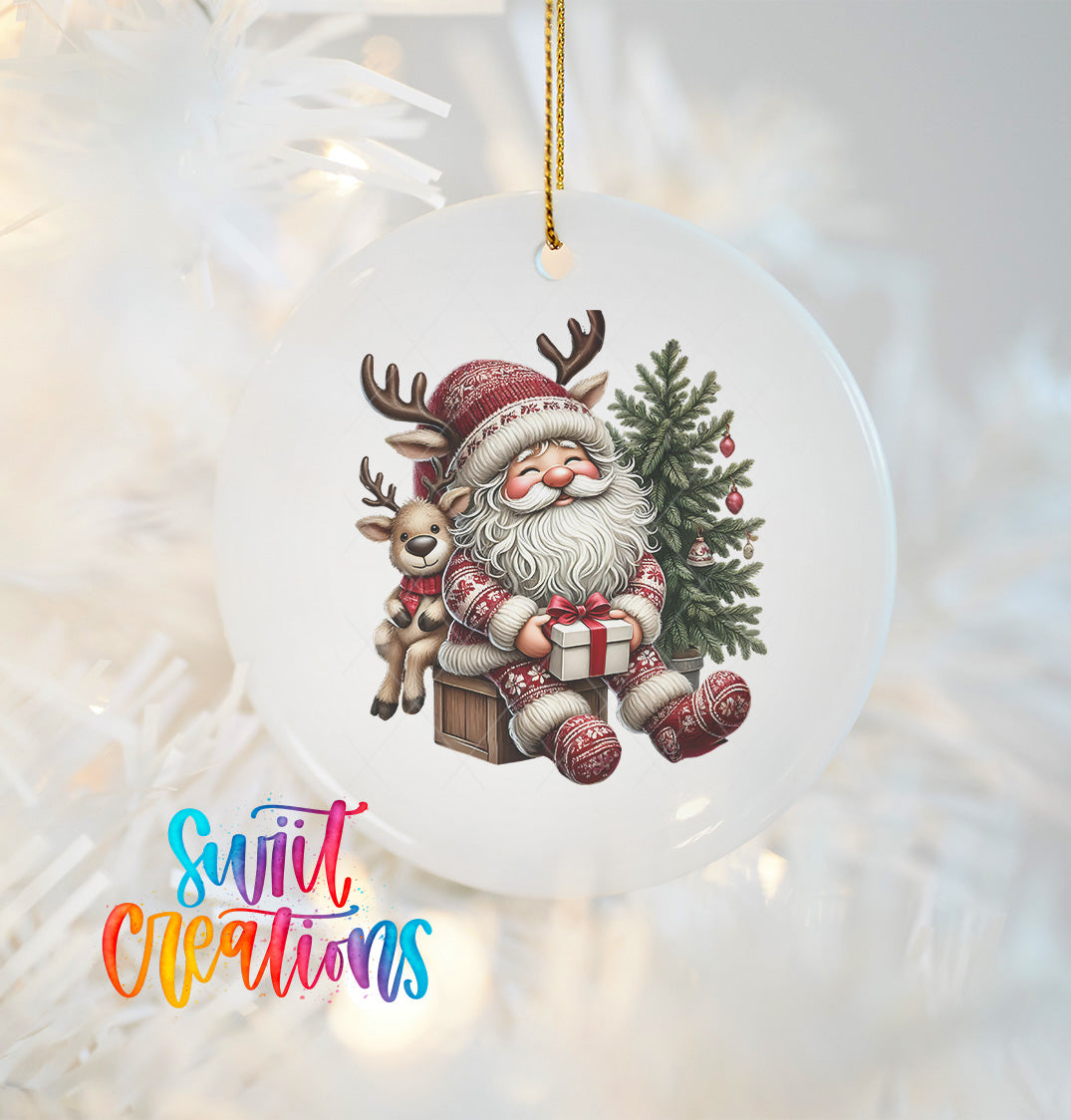 A white ornament featuring a smiling Santa Claus holding a reindeer and a Christmas tree, with the text "Swift Creations" below the image.