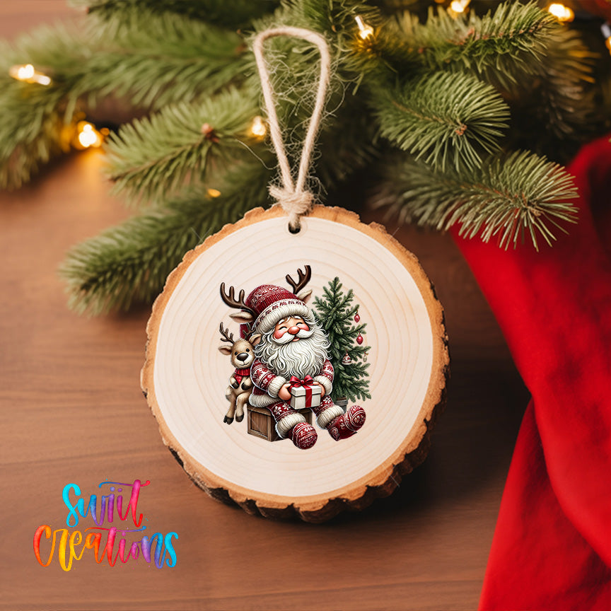 A wooden ornament featuring a smiling Santa Claus sitting on a reindeer, surrounded by Christmas decorations and a Christmas tree.