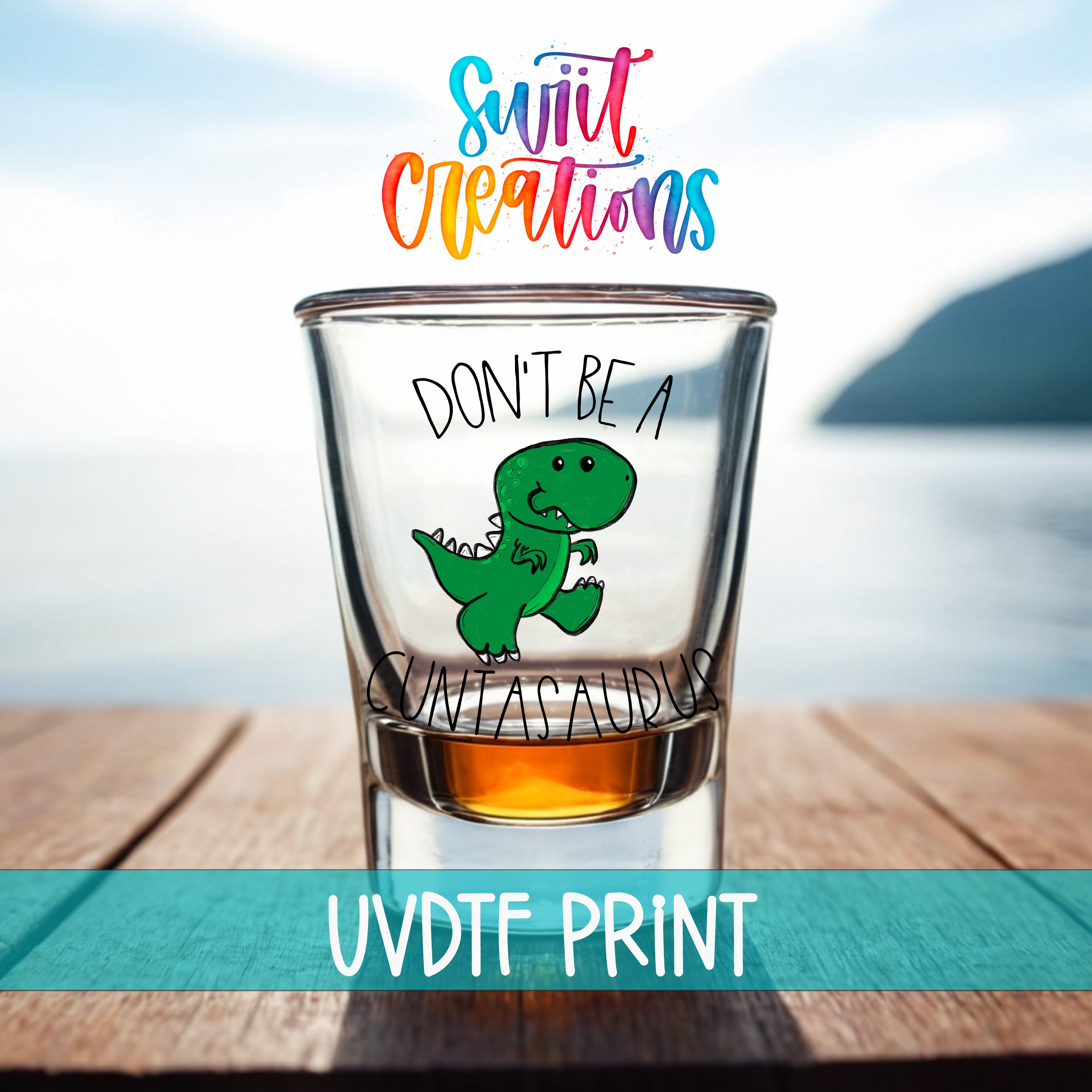 a shot glass with a cartoon dinosaur and the text "DON'T BE A CUTASaurus" printed on it.