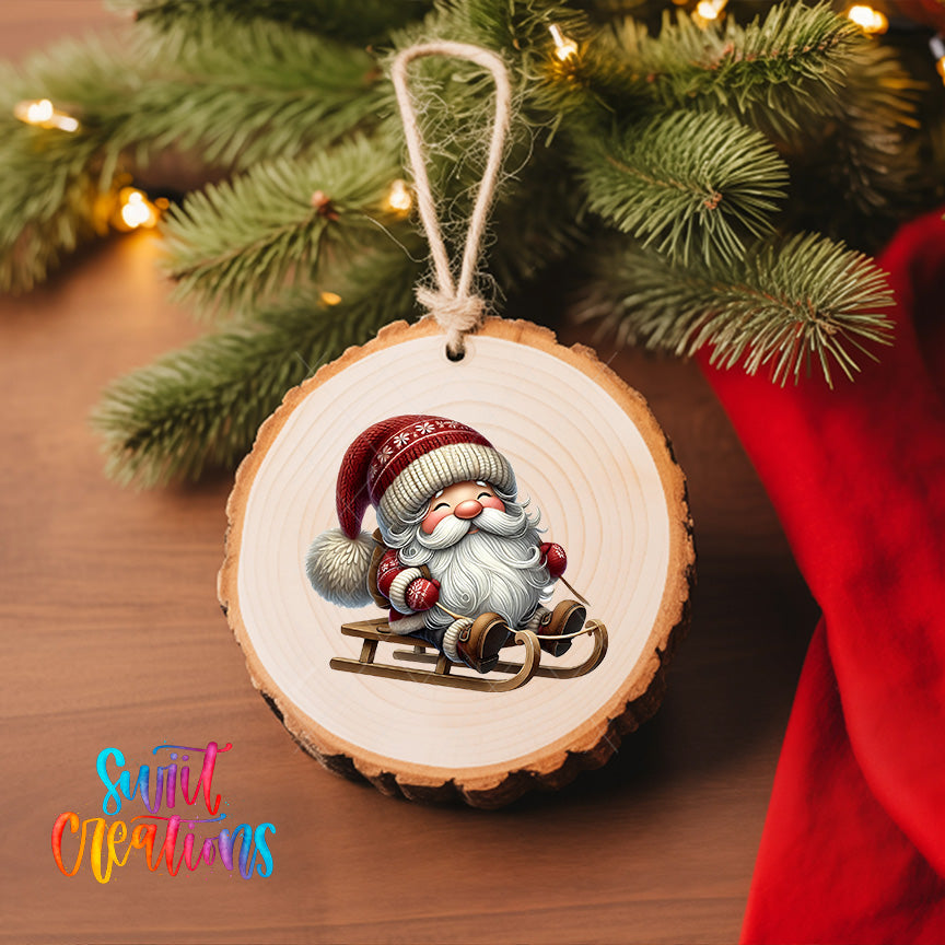 A wooden ornament featuring a smiling Santa Claus on a sled, hanging on a Christmas tree.