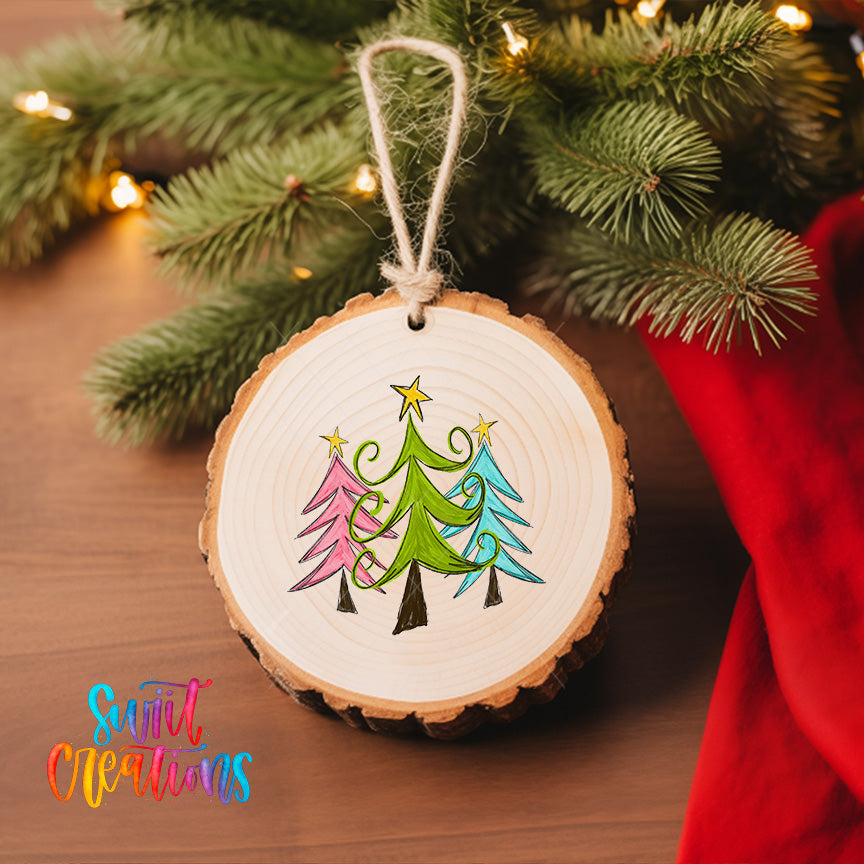 A wooden ornament with a tree design hangs on a Christmas tree, surrounded by twinkling lights.