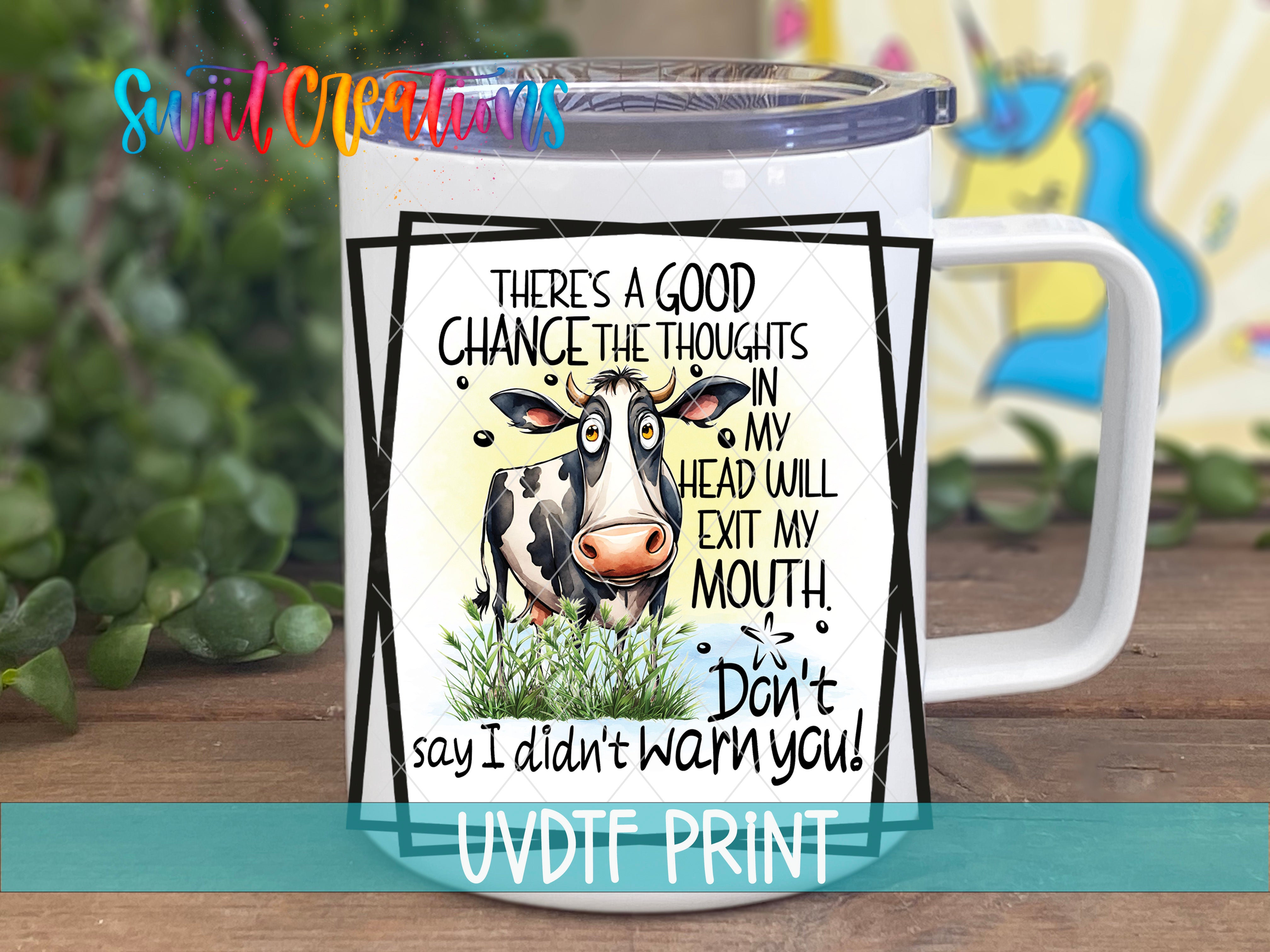 A white mug with a humorous text and an illustration of a cow.