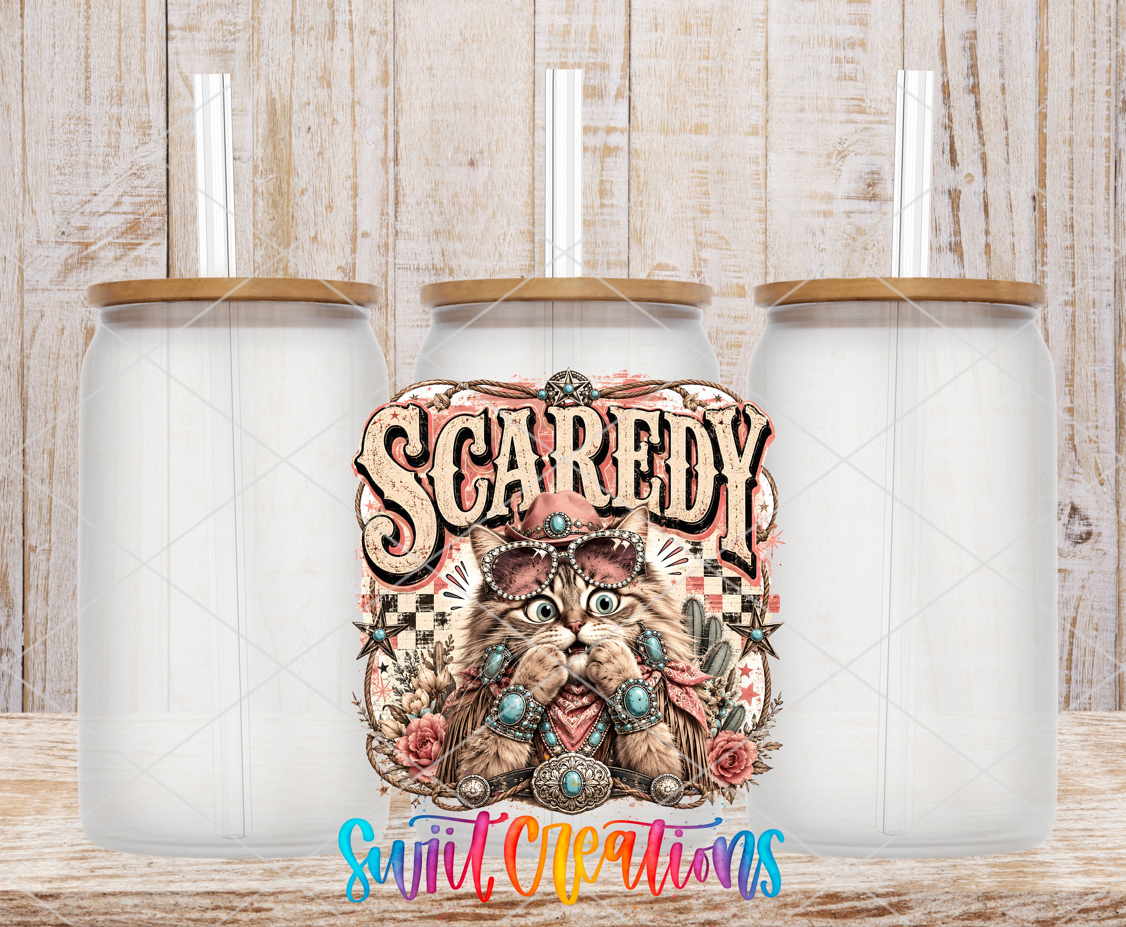 a colorful illustration of a cat with a decorative hat and a sign that says "Scaredy" in the center. There are three identical glass jars with lids placed in front of the illustration.
