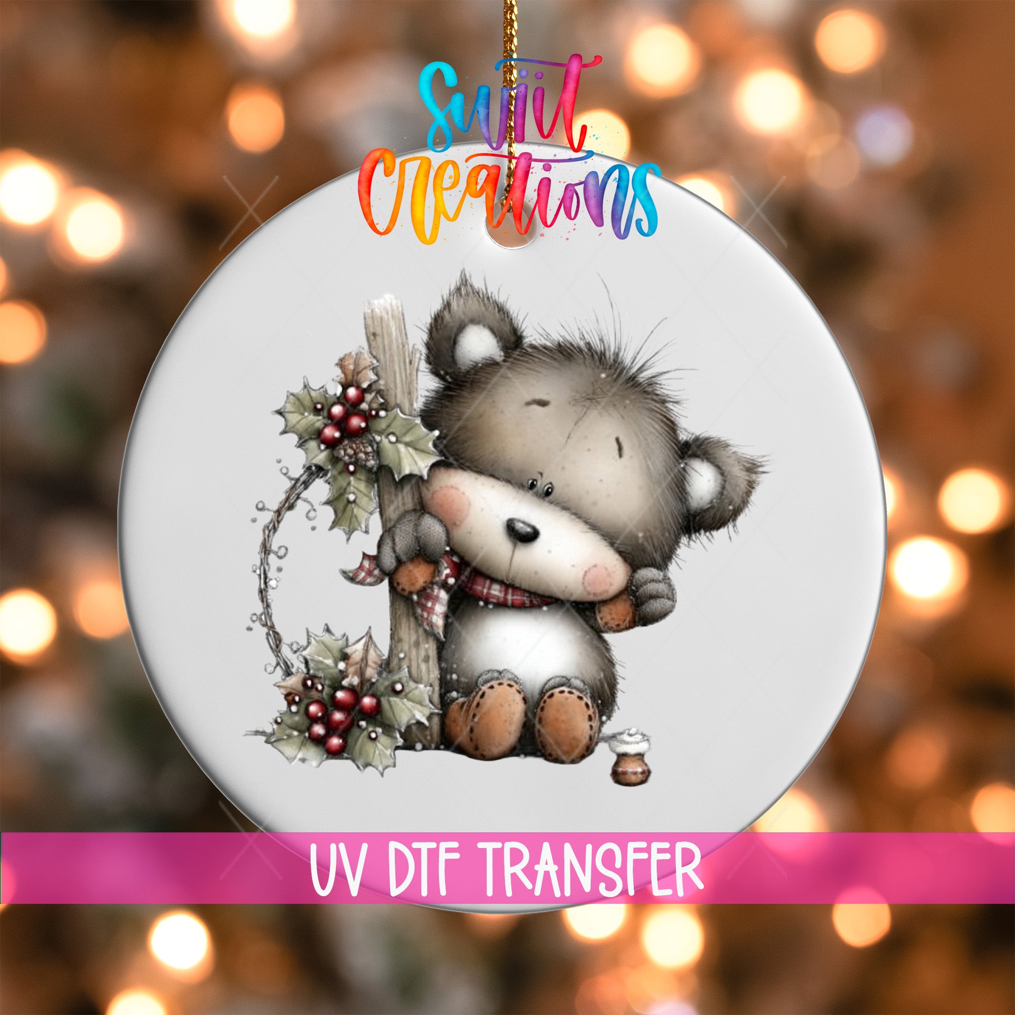 A white ornament with a cute bear holding a holly leaf and berries, surrounded by a colorful background with blurred lights.