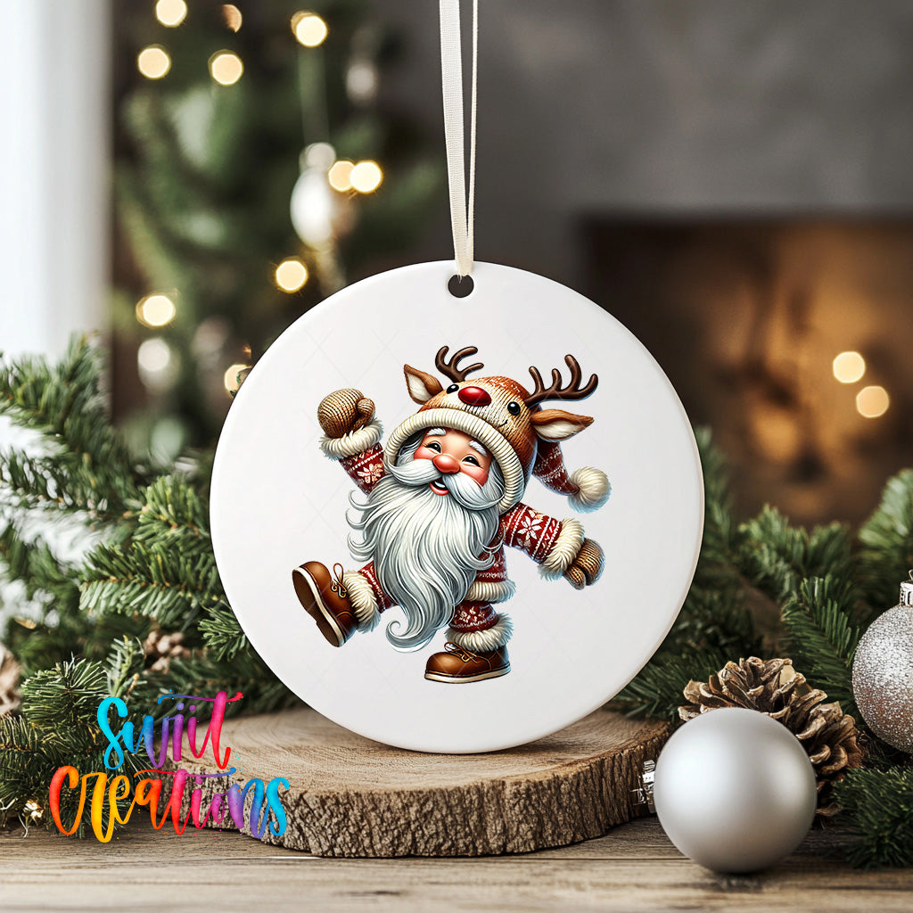 A white ceramic ornament featuring a smiling Santa Claus character with antlers, surrounded by Christmas decorations such as pine cones and ornaments.