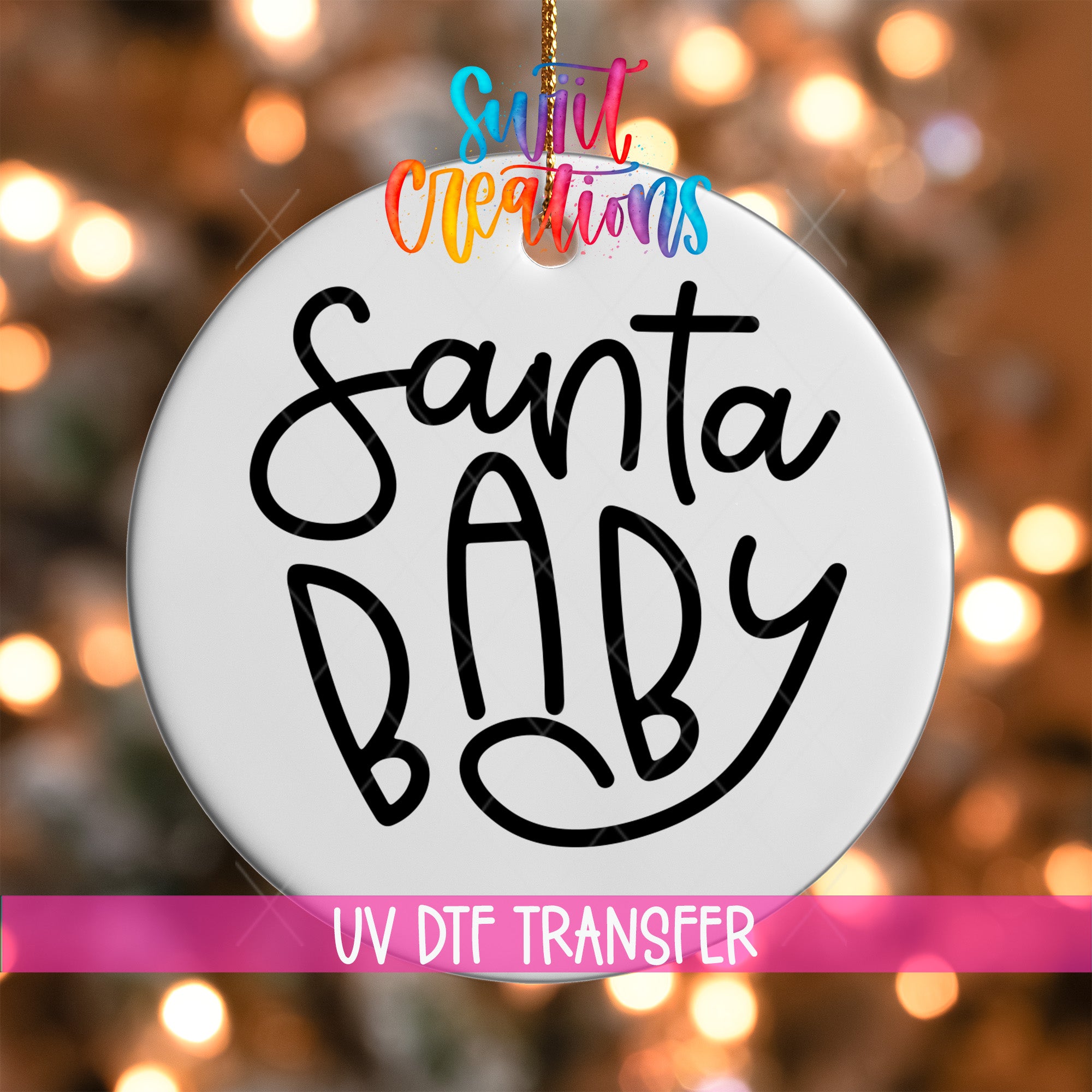 A white ornament with the text "Santa Baby" written on it, hanging against a background of colorful lights.