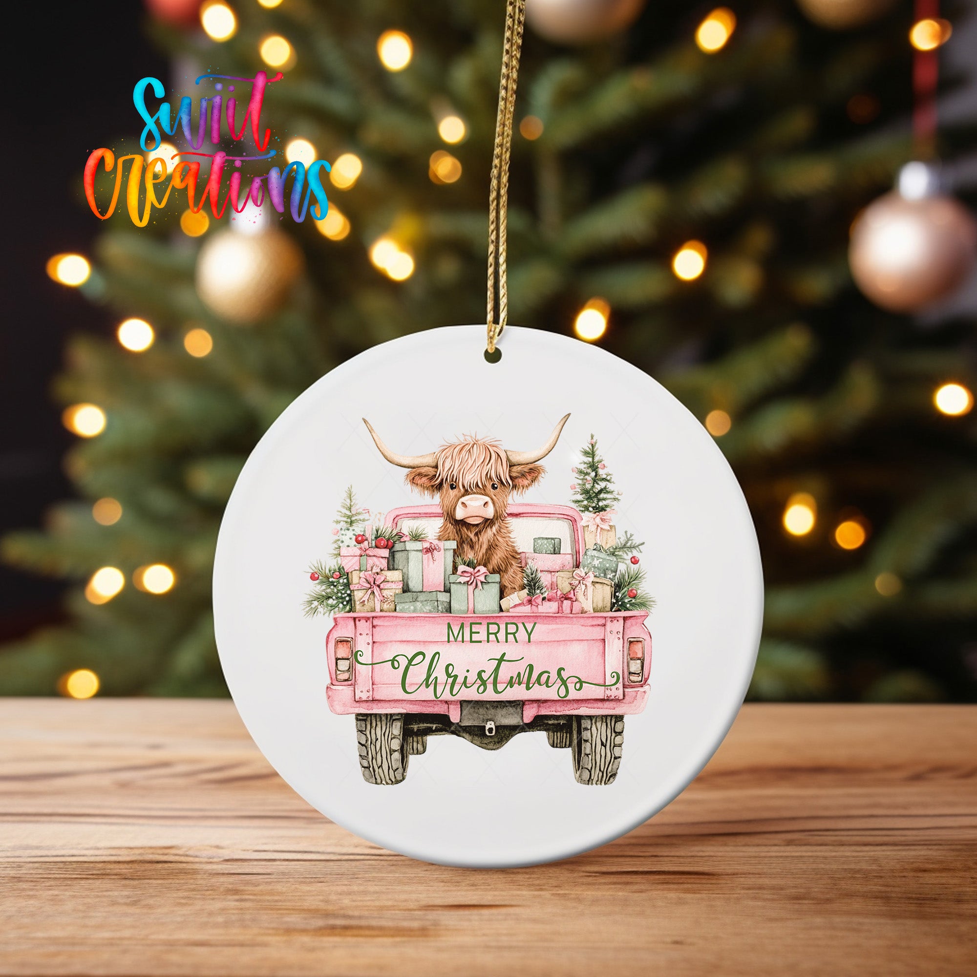 A white ceramic ornament featuring a cartoon cow with horns and a pink truck, with the text "MERRY CHRISTMAS" displayed on the back of the truck.