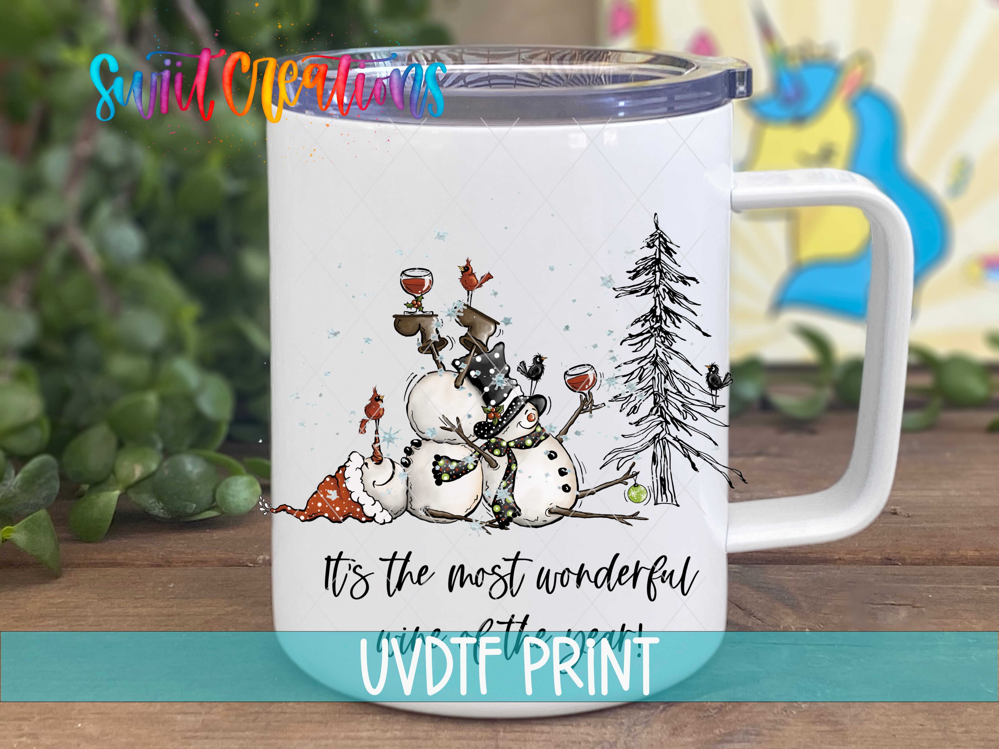 a white coffee mug with a picture of a snowman on it