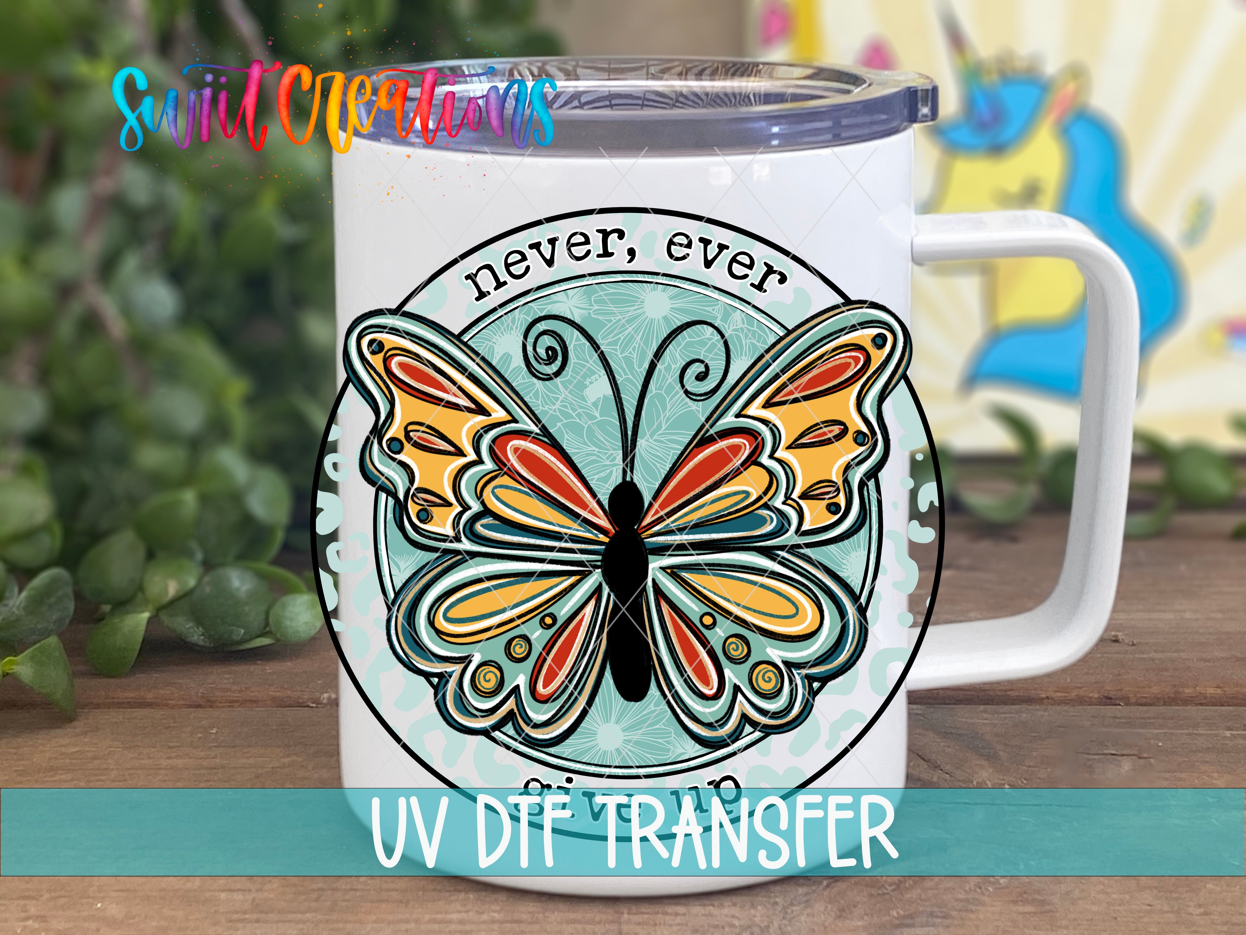 Swiit Creations UV DTF Never Ever Give Up transfer displayed on a white coffee mug
