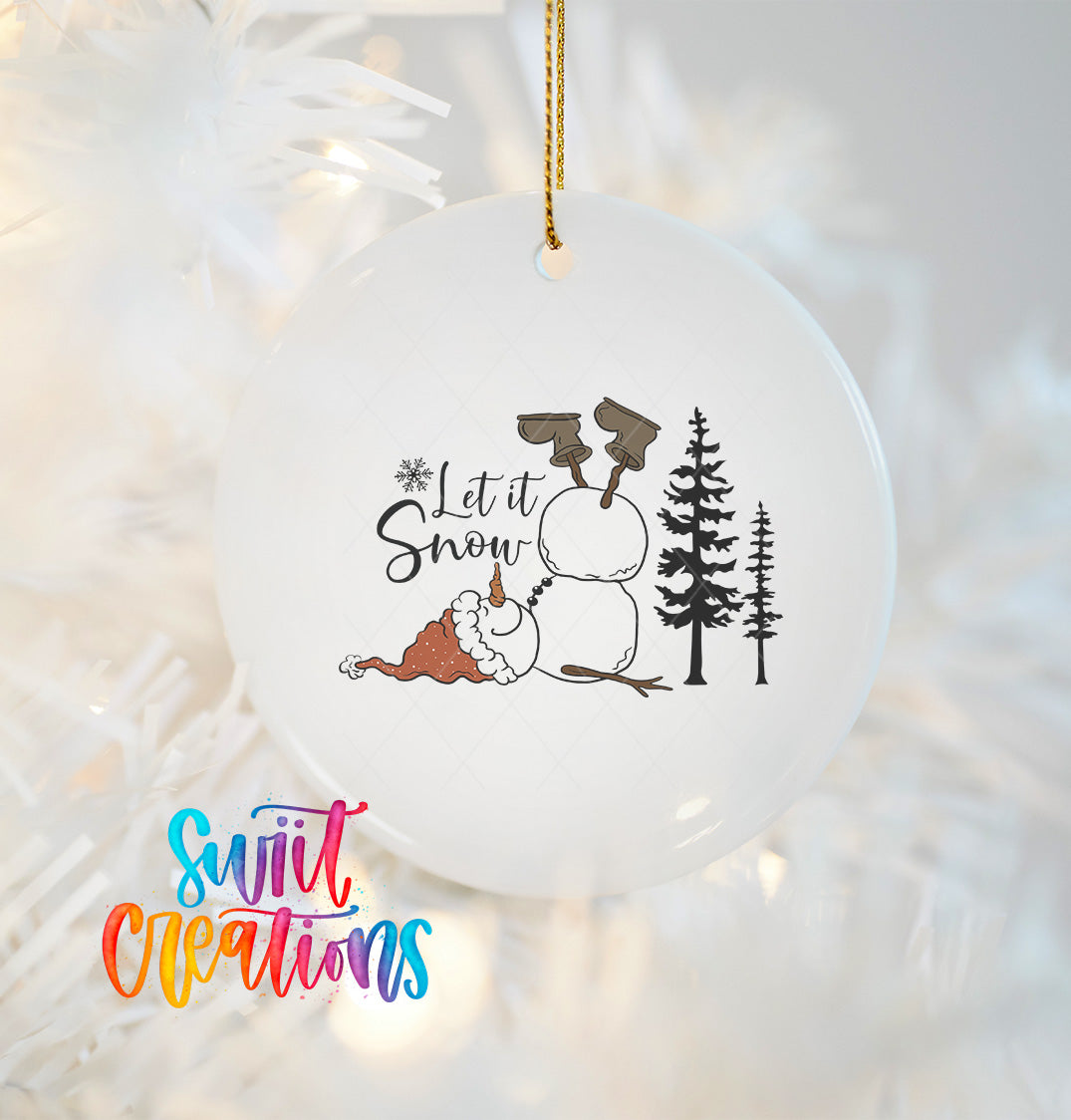 A white ornament with a snowman and trees, along with the text "Let it Snow" and a snowman.
