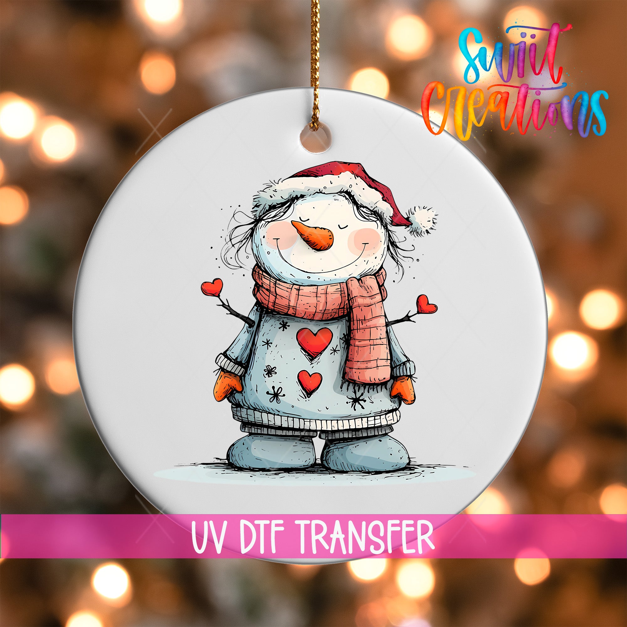 A snowman ornament with a red scarf and a heart-shaped scarf, wearing a Santa hat, is hanging on a string.