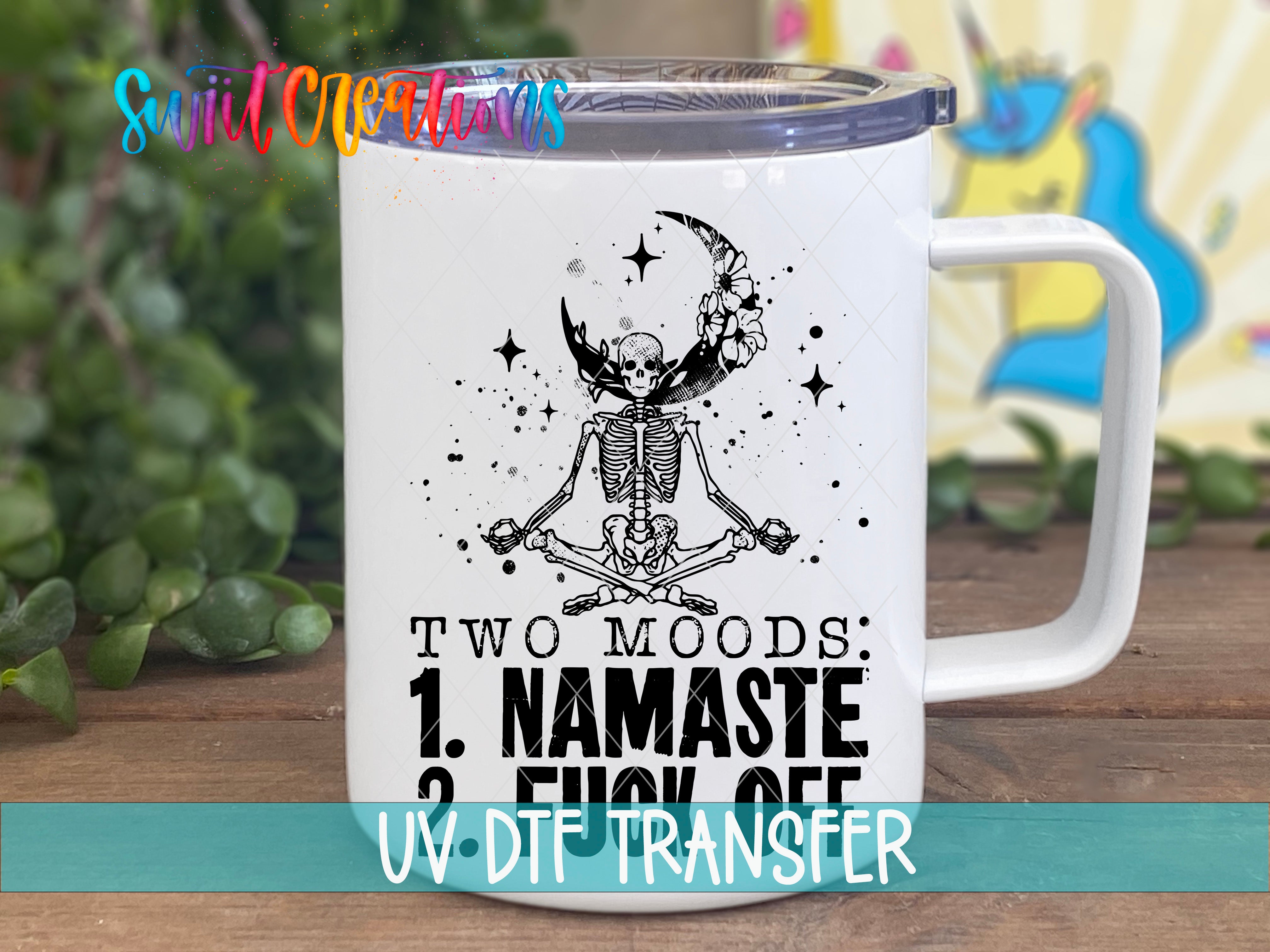 Swiit Creations Two Moods Namaste or Fuck Off UV DTF transfer displayed on a white coffee mug