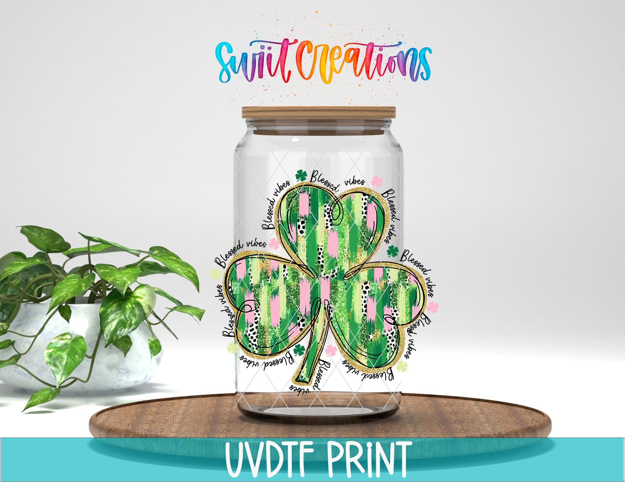 a glass jar with a shamrock painted on it