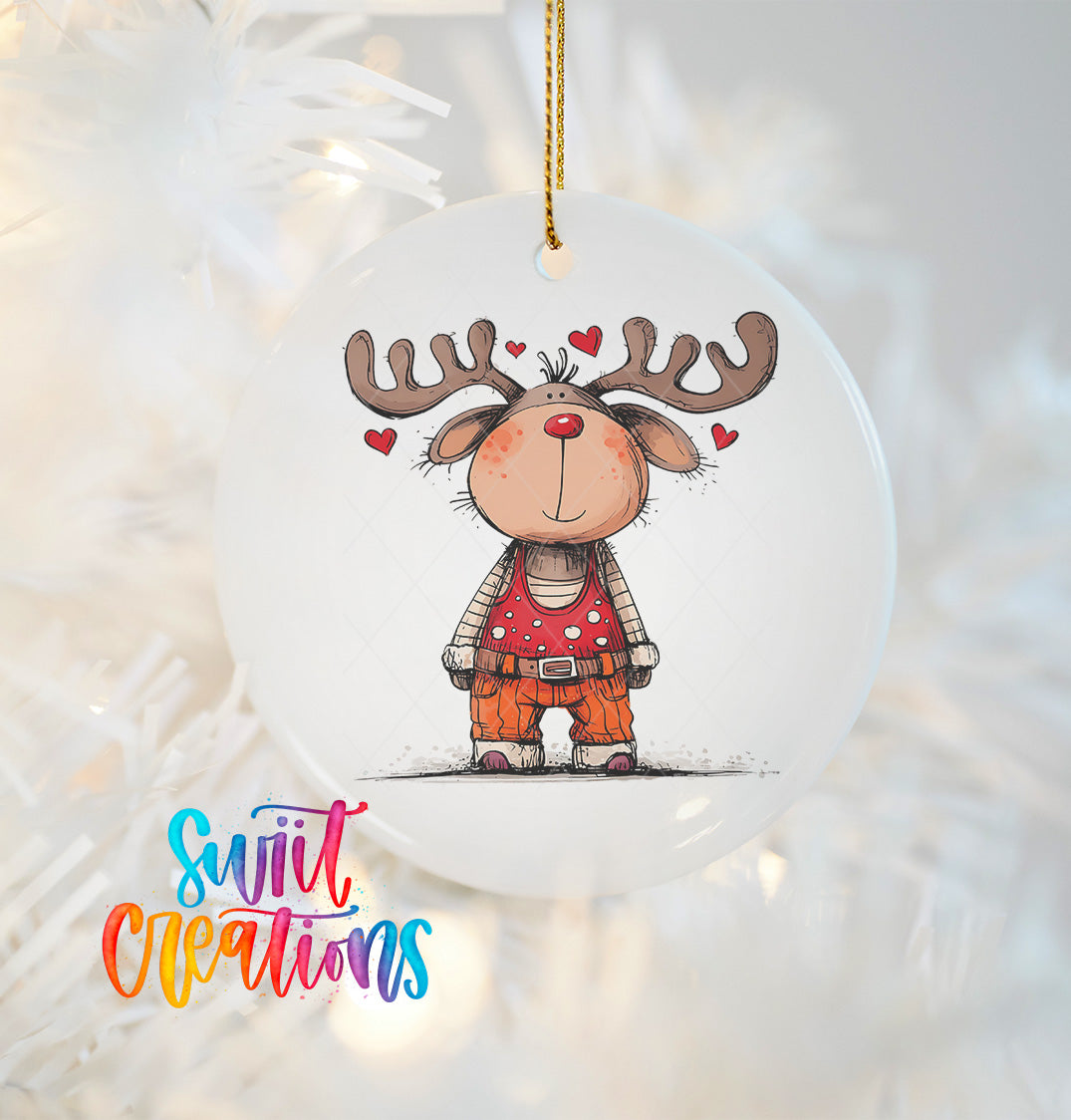 A white ornament with a cartoon reindeer wearing a red outfit and surrounded by hearts.