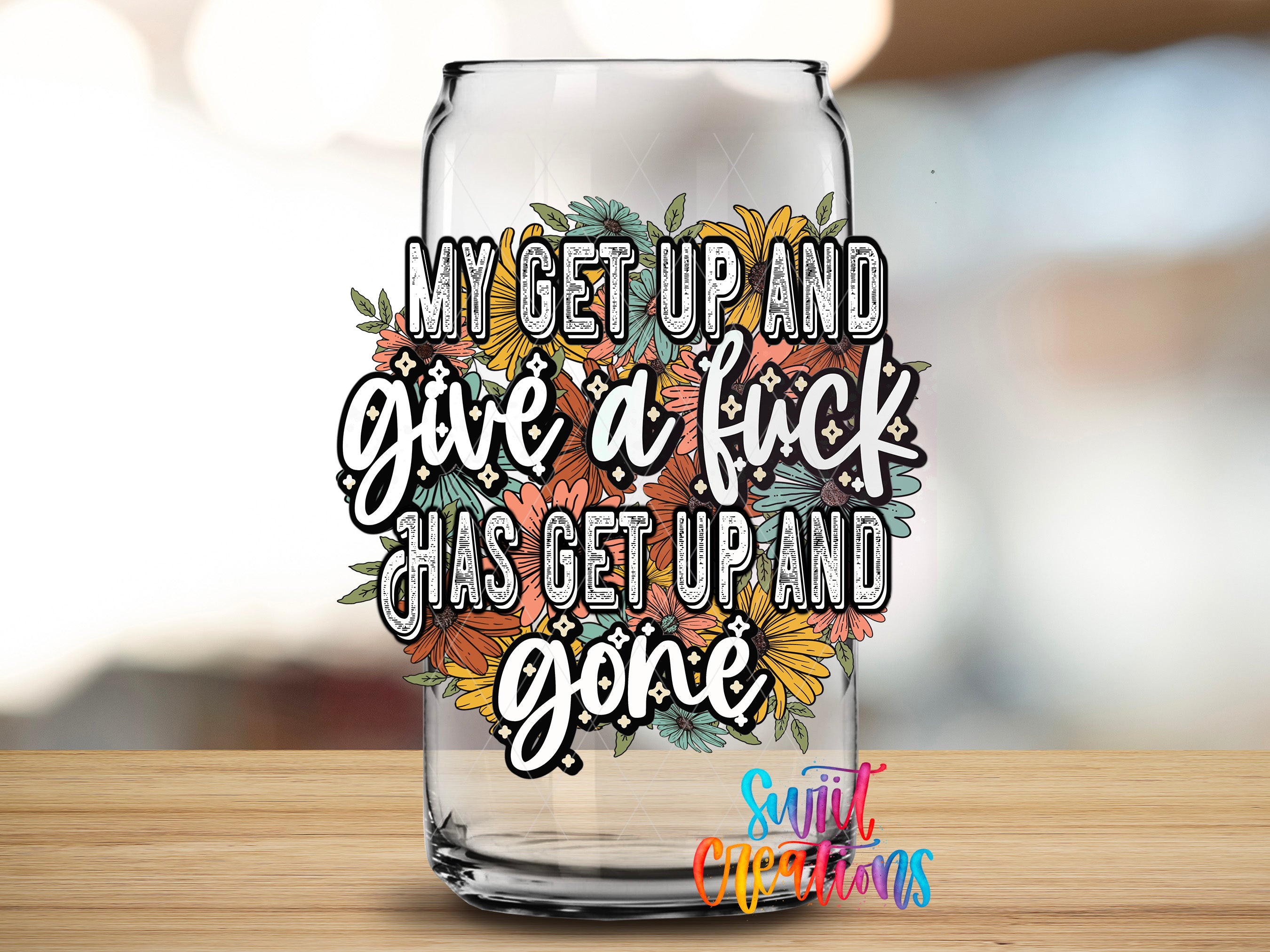a glass can with a colorful, hand-drawn design and text on it.