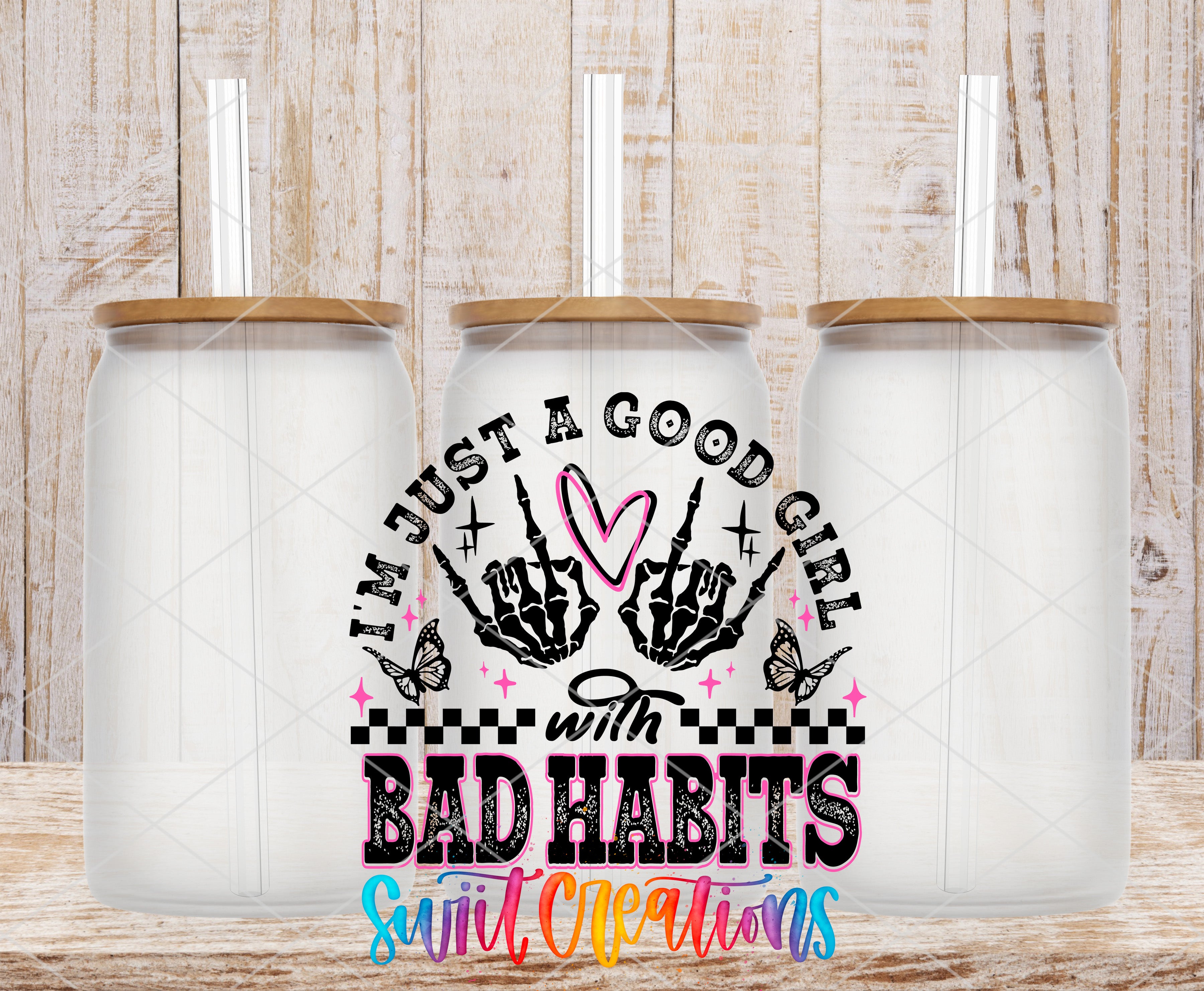 three glass jars with lids, each containing a straw. The jars are arranged in a row, and there is a colorful graphic design in the center that includes text and illustrations related to the phrase "I'm just a good girl with bad habits".
