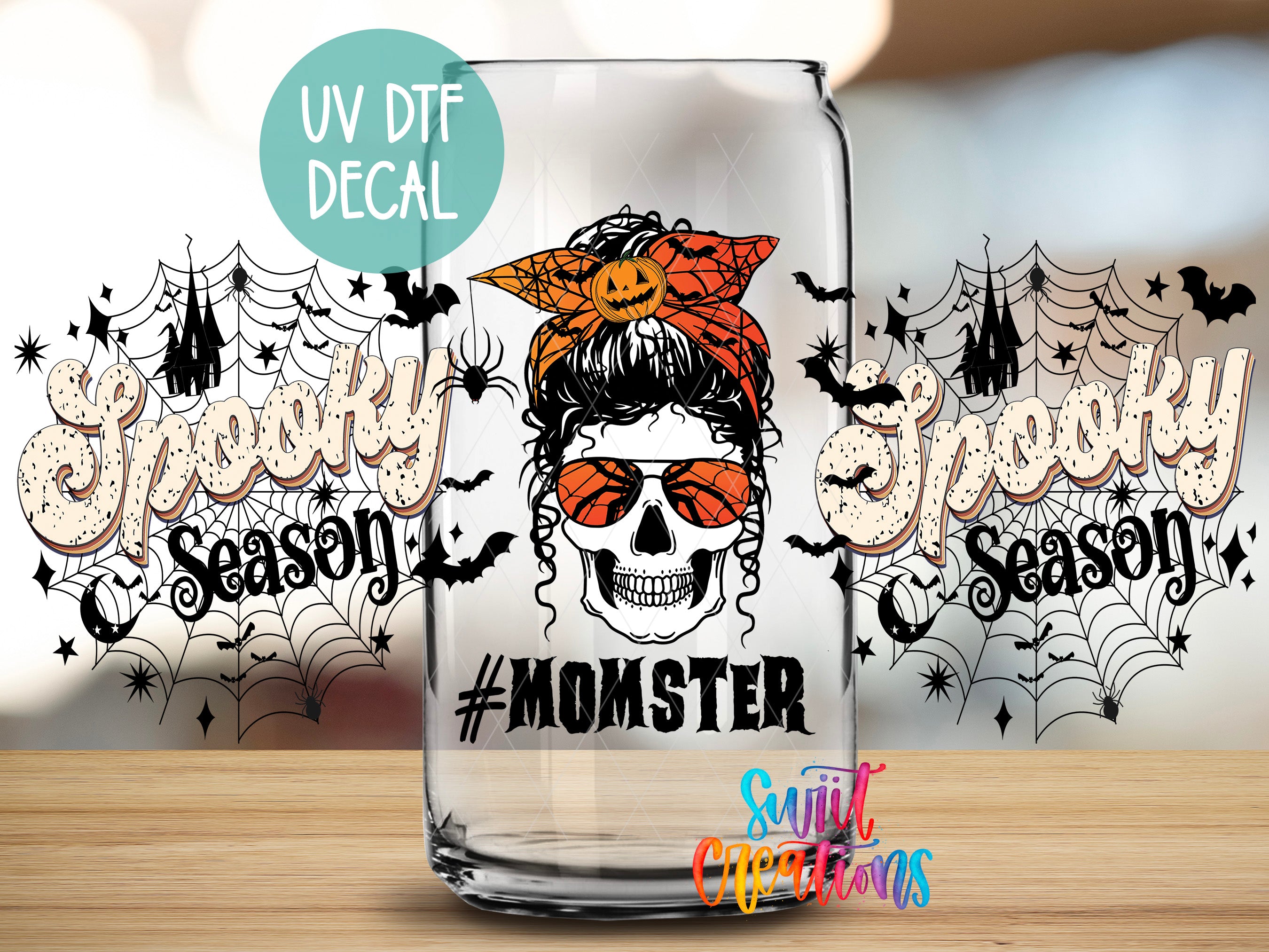 A Halloween-themed decal featuring a skull with a bandana, sunglasses, and the text "#MOMSTER" is displayed on a glass jar.