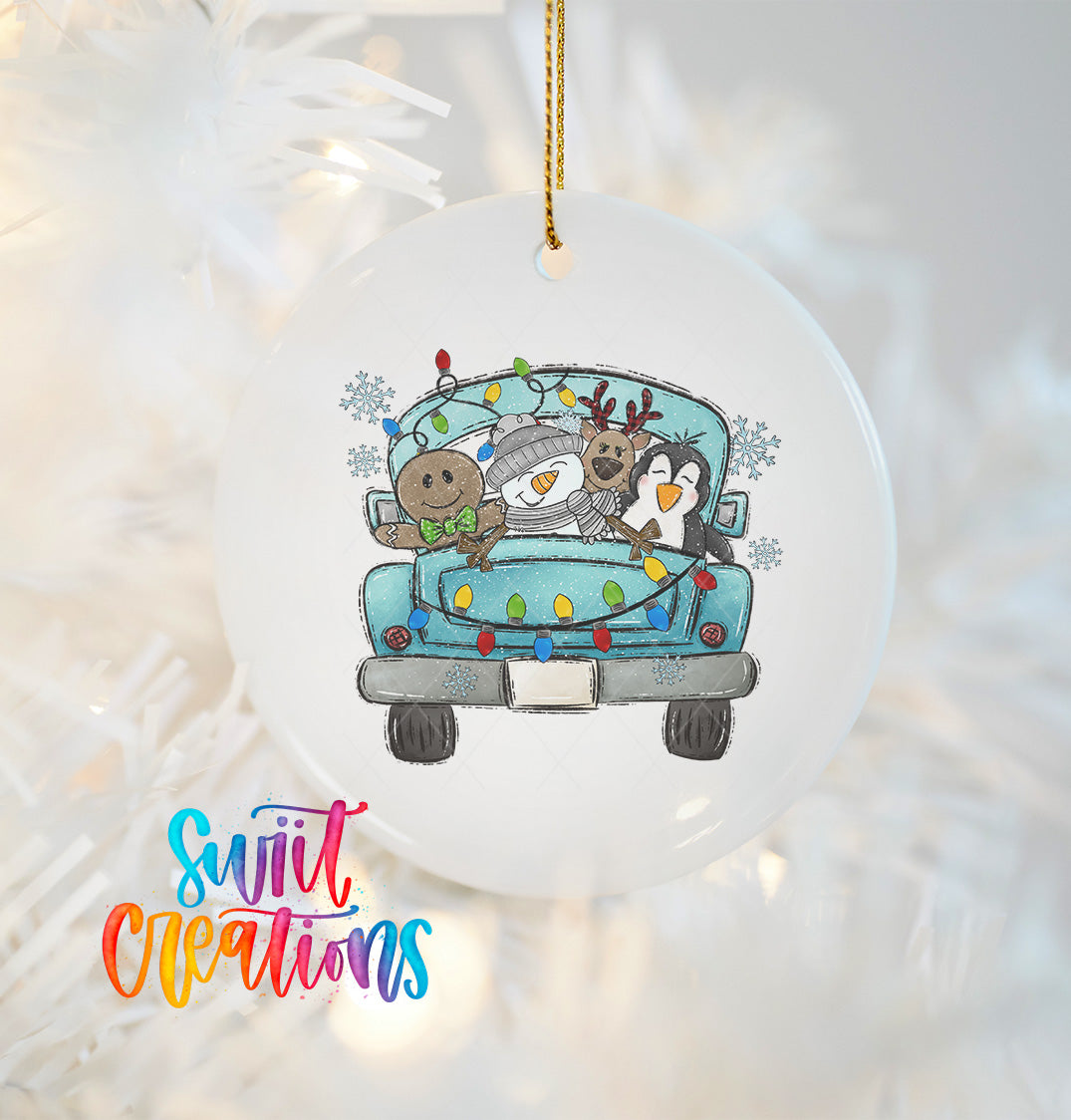 A white ornament with a cartoon illustration of a snowman, reindeer, and penguin riding in the back of a truck decorated with Christmas lights.