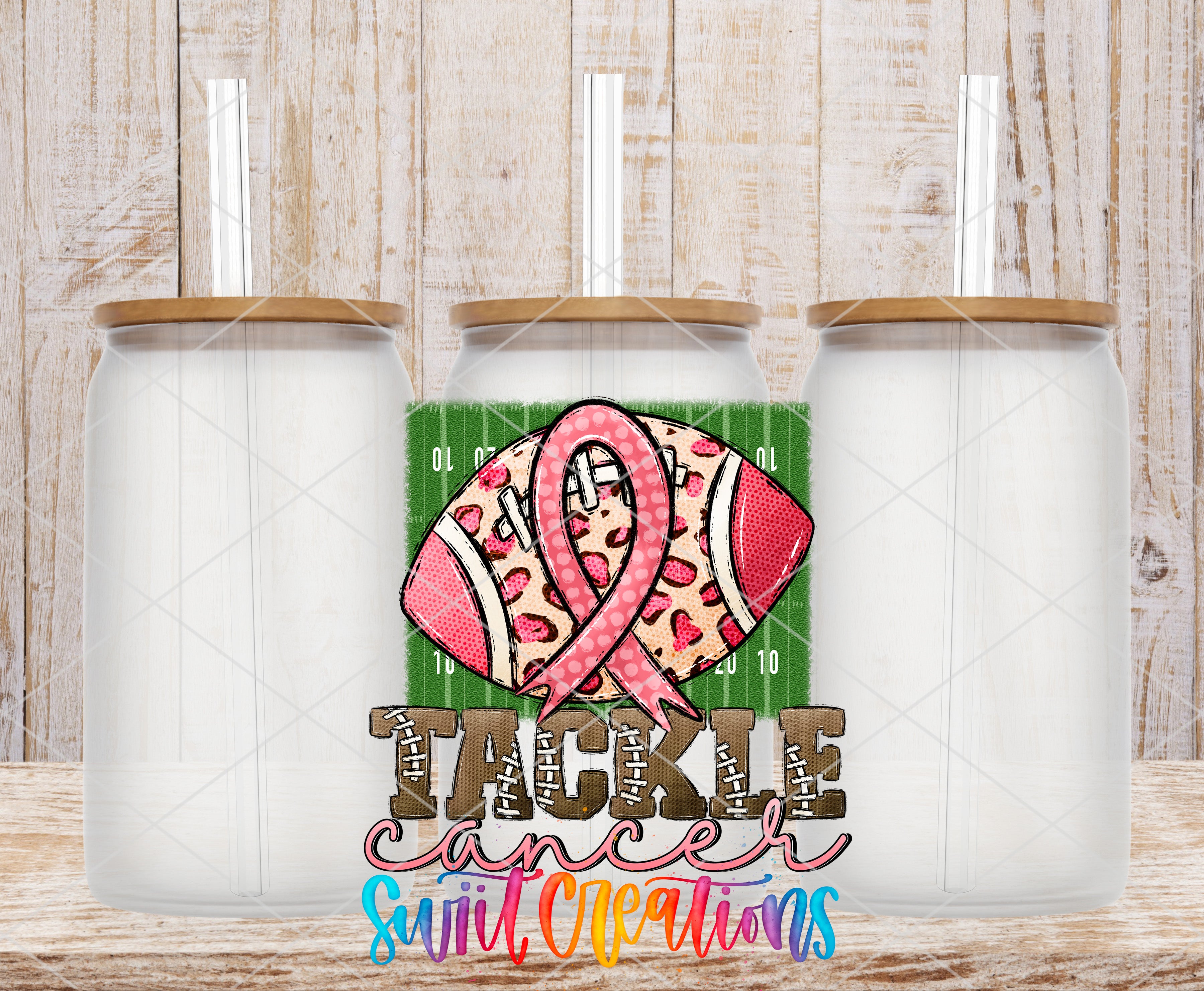 three clear glass jars with brown lids, each with a straw, arranged in a row against a wooden background. The jars are positioned in such a way that they create a visually appealing composition.