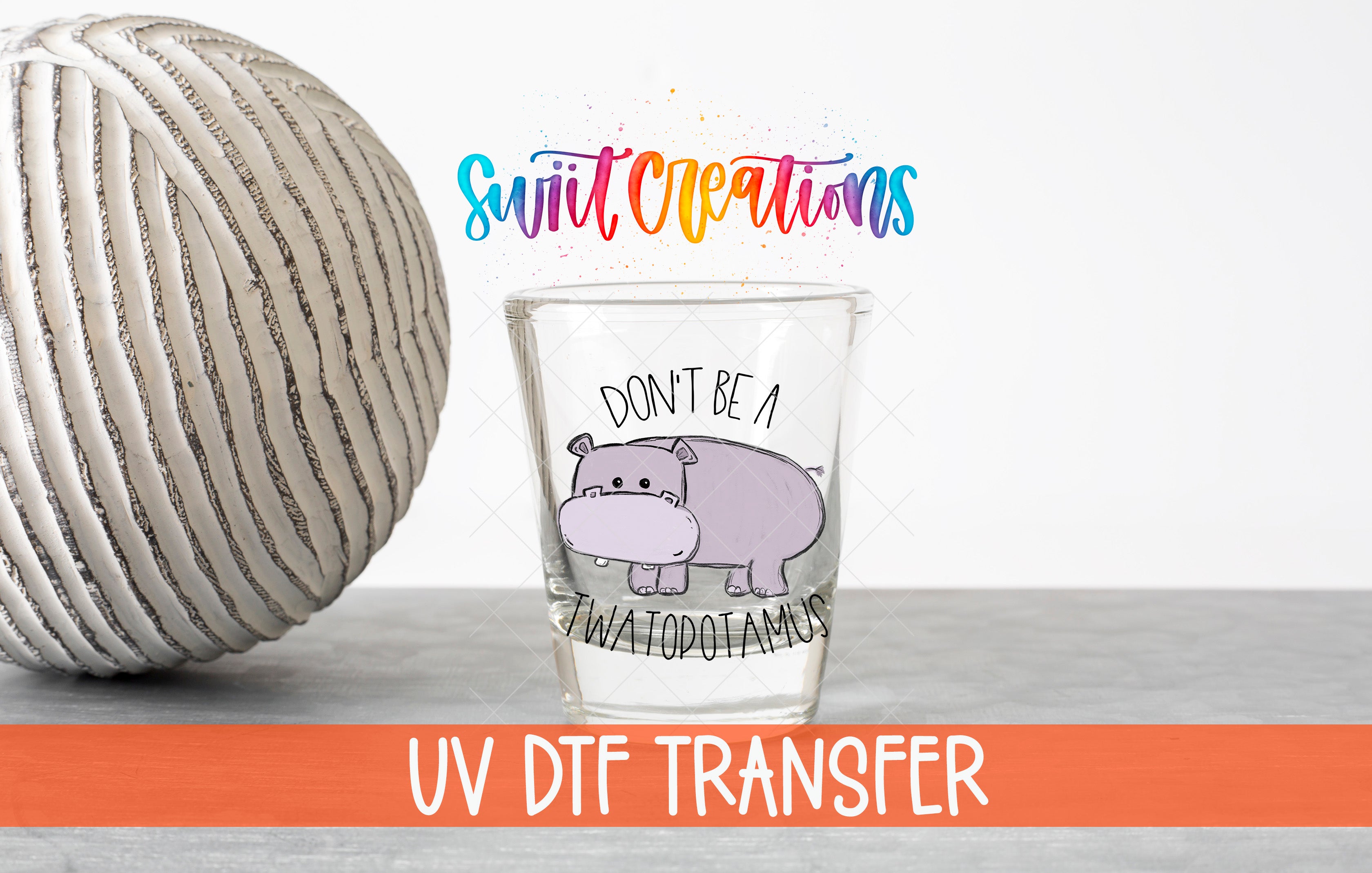 a glass with a cartoon hippo and the text "Don't be a water droplet amanda" on it, along with a rainbow-colored text overlay that says "Swift Creations UV Dtf Transfer".