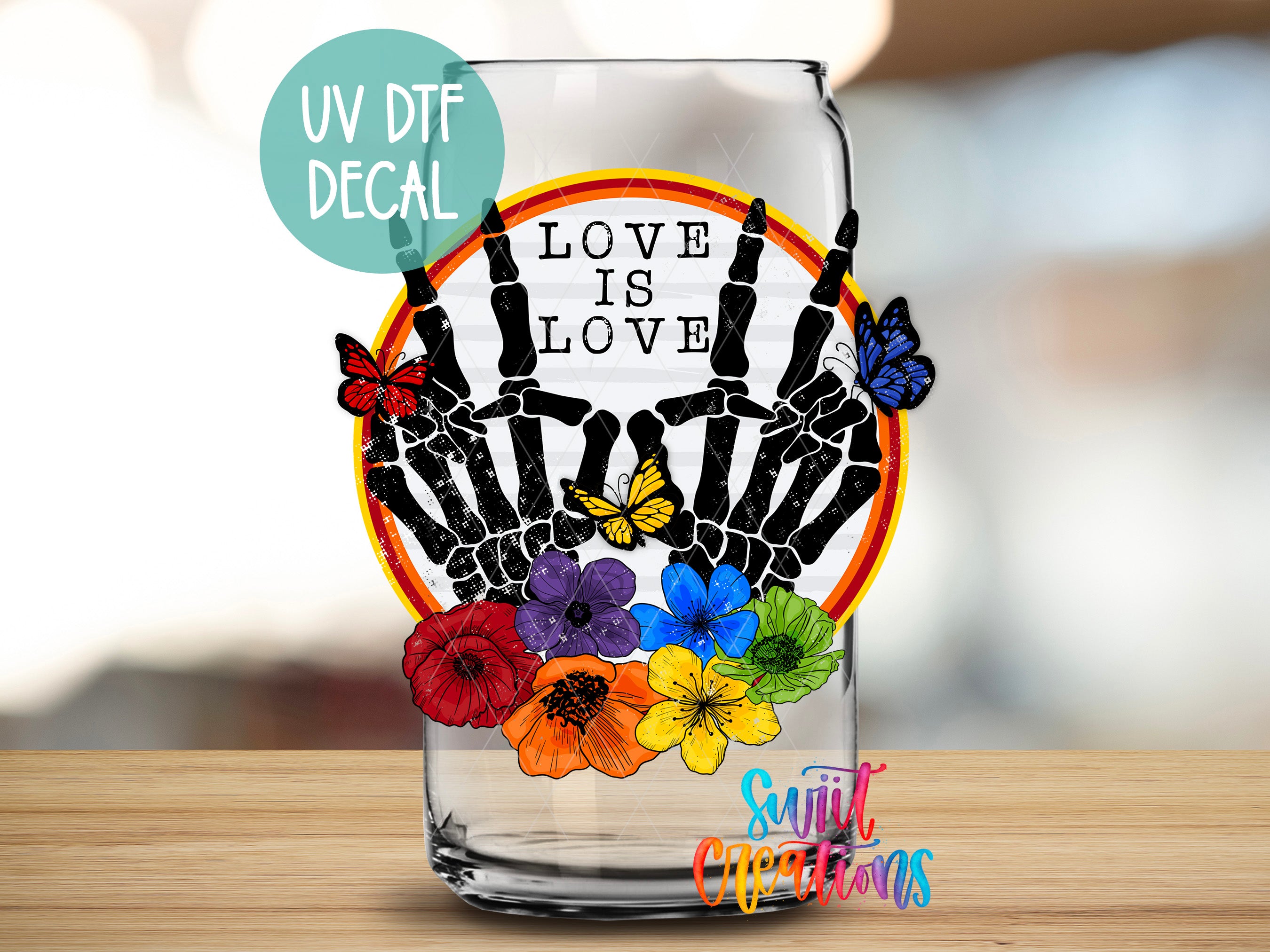 a glass with a picture of a hand holding flowers