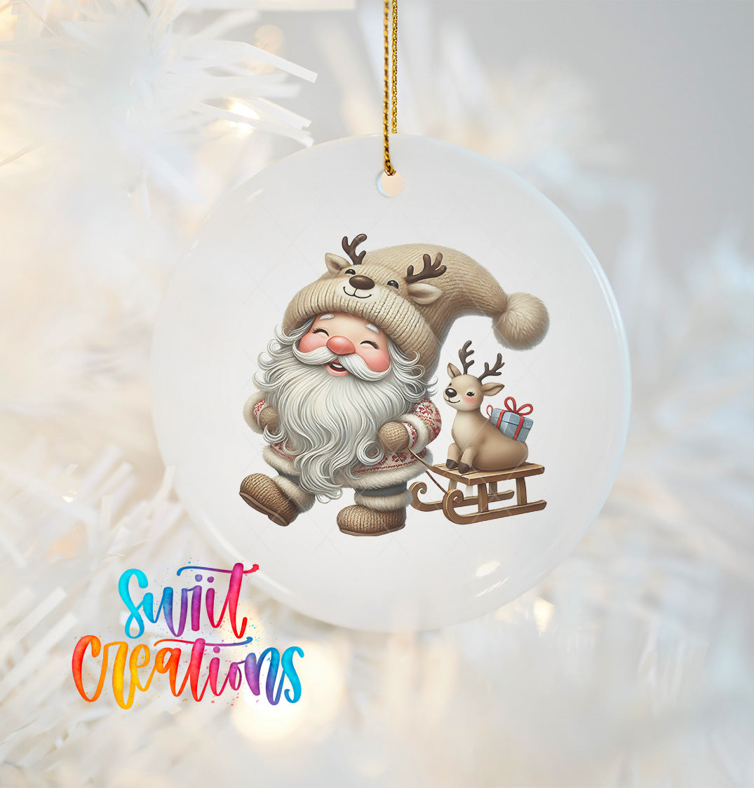 A white ornament featuring a smiling gnome with a beard and antlers, holding a reindeer on a sled, and a small gift box.
