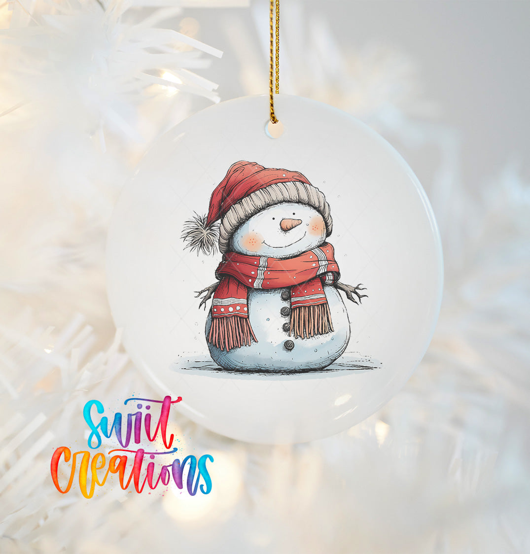 A snowman ornament with a red scarf and hat, and a carrot nose, is hanging on a Christmas tree.